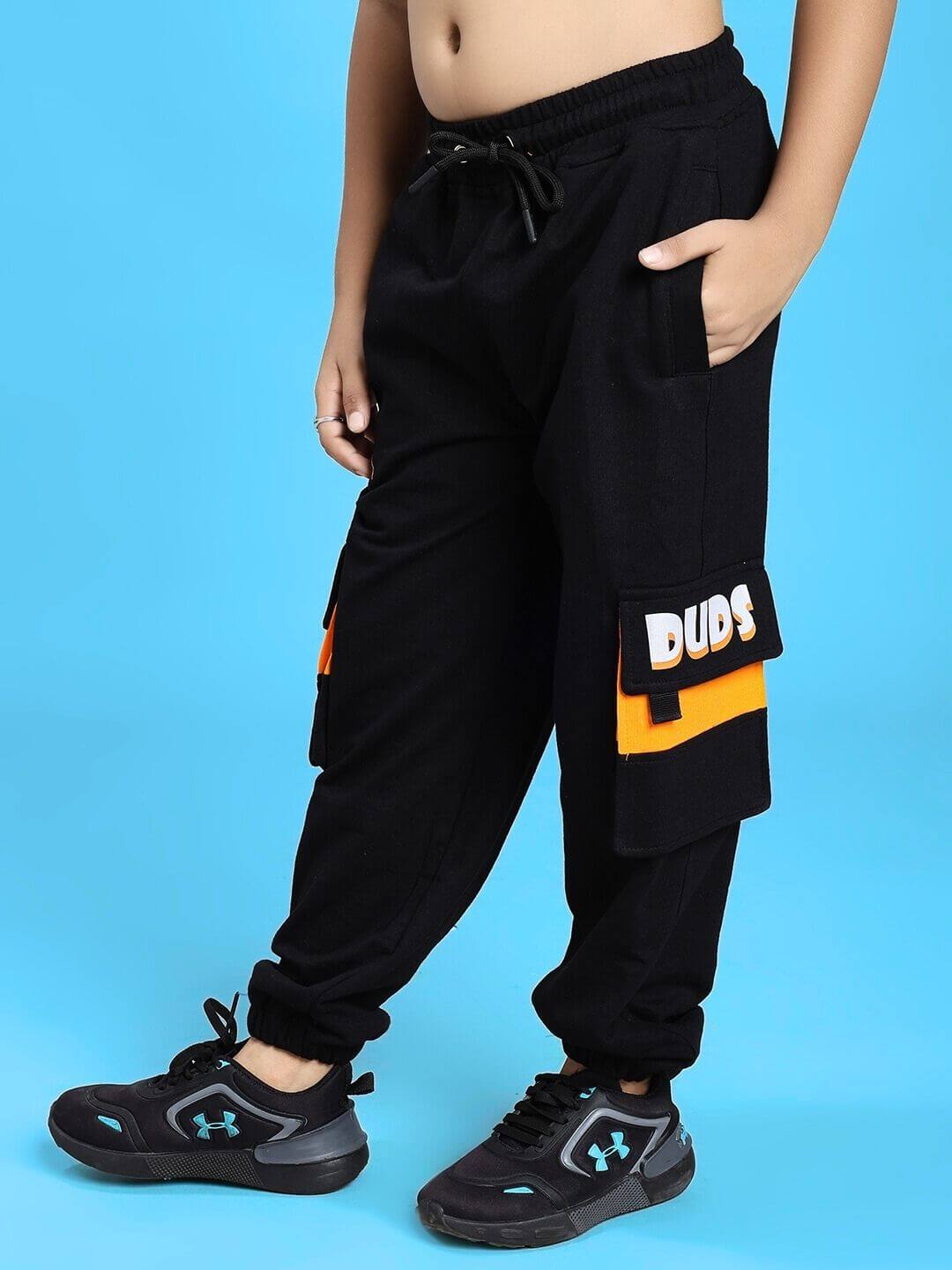 Child wearing TIGON KIDS JOGGER FOR BOYS AND GIRLS RED BLACK, featuring sporty design, comfortable fit, and bold color contrast.