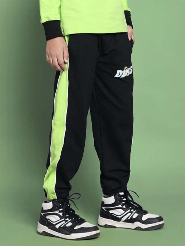 Black and neon green TILLY jogger for boys and girls, featuring sporty design, by DUDS. Perfect for casual wear and custom fit available.