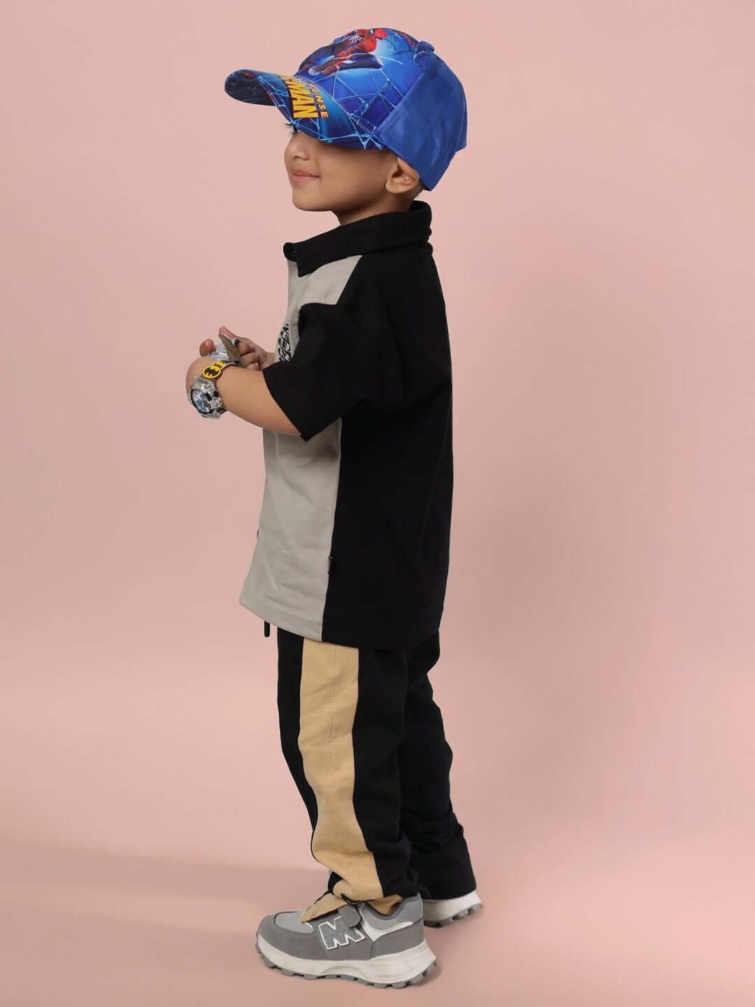 Child wearing TINGE CO-ORD FOR BOYS & GIRLS GREY BLACK set, featuring sporty streetwear style, ideal for casual outings and activities.