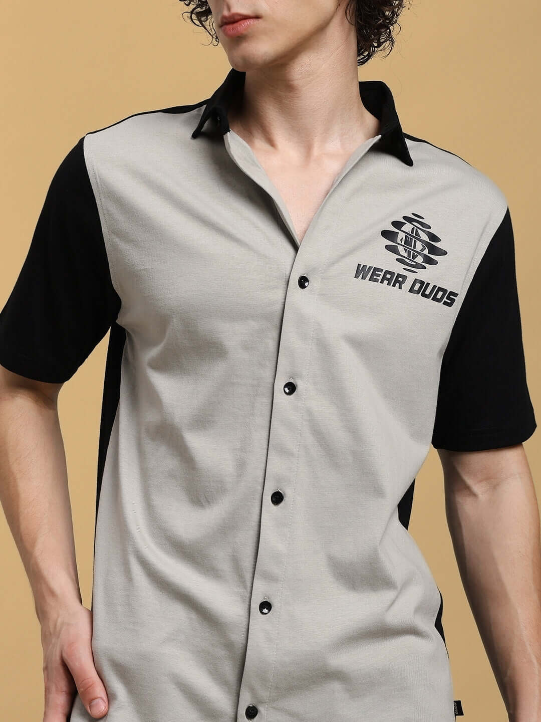 Man wearing TINGE regular fit grey-black shirt featuring "Wear DUDS" logo, designed for custom fitting by experienced tailors.