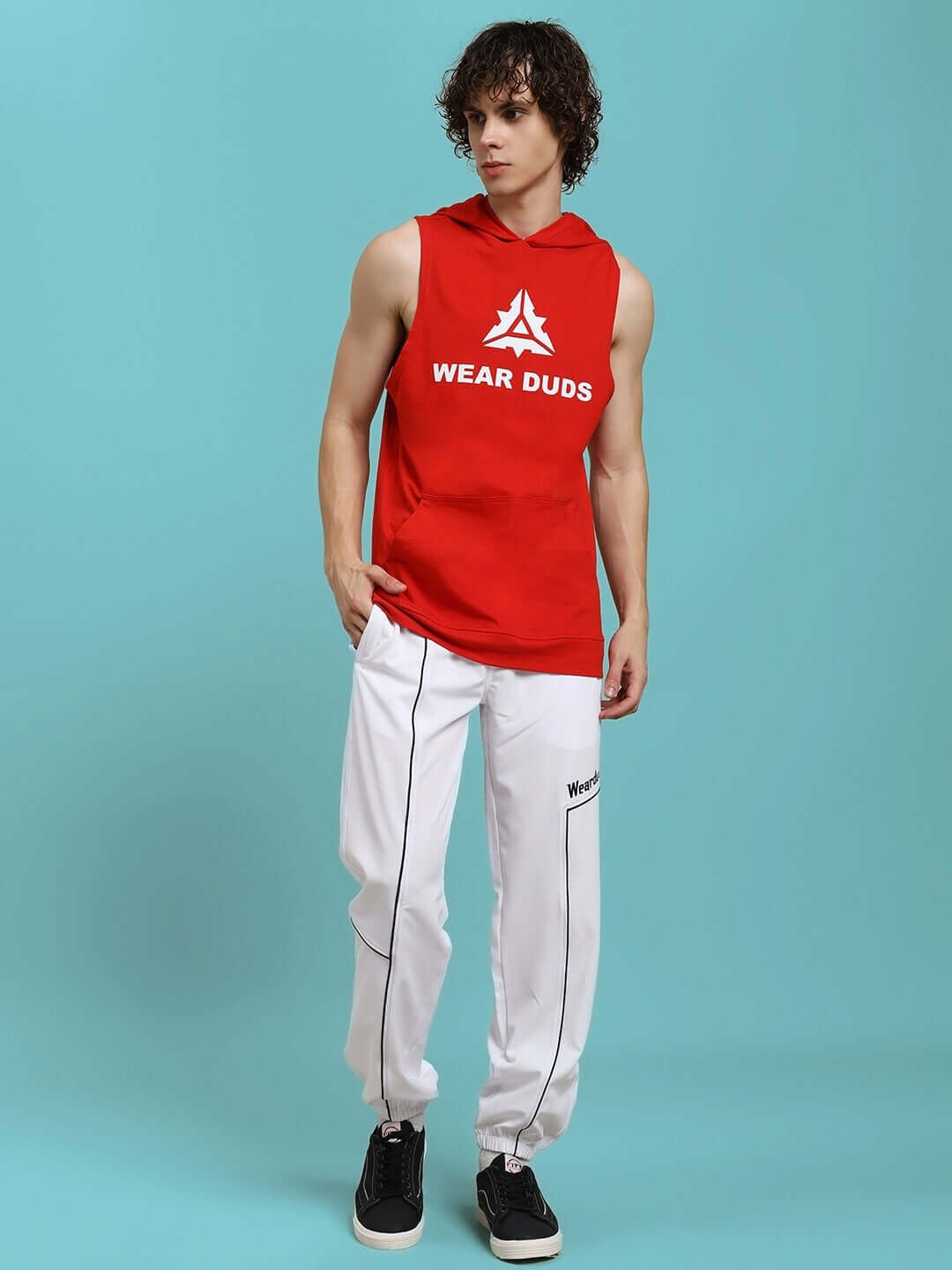 Model wearing Tokyo Relaxed Fit Joggers White with red sleeveless hoodie.