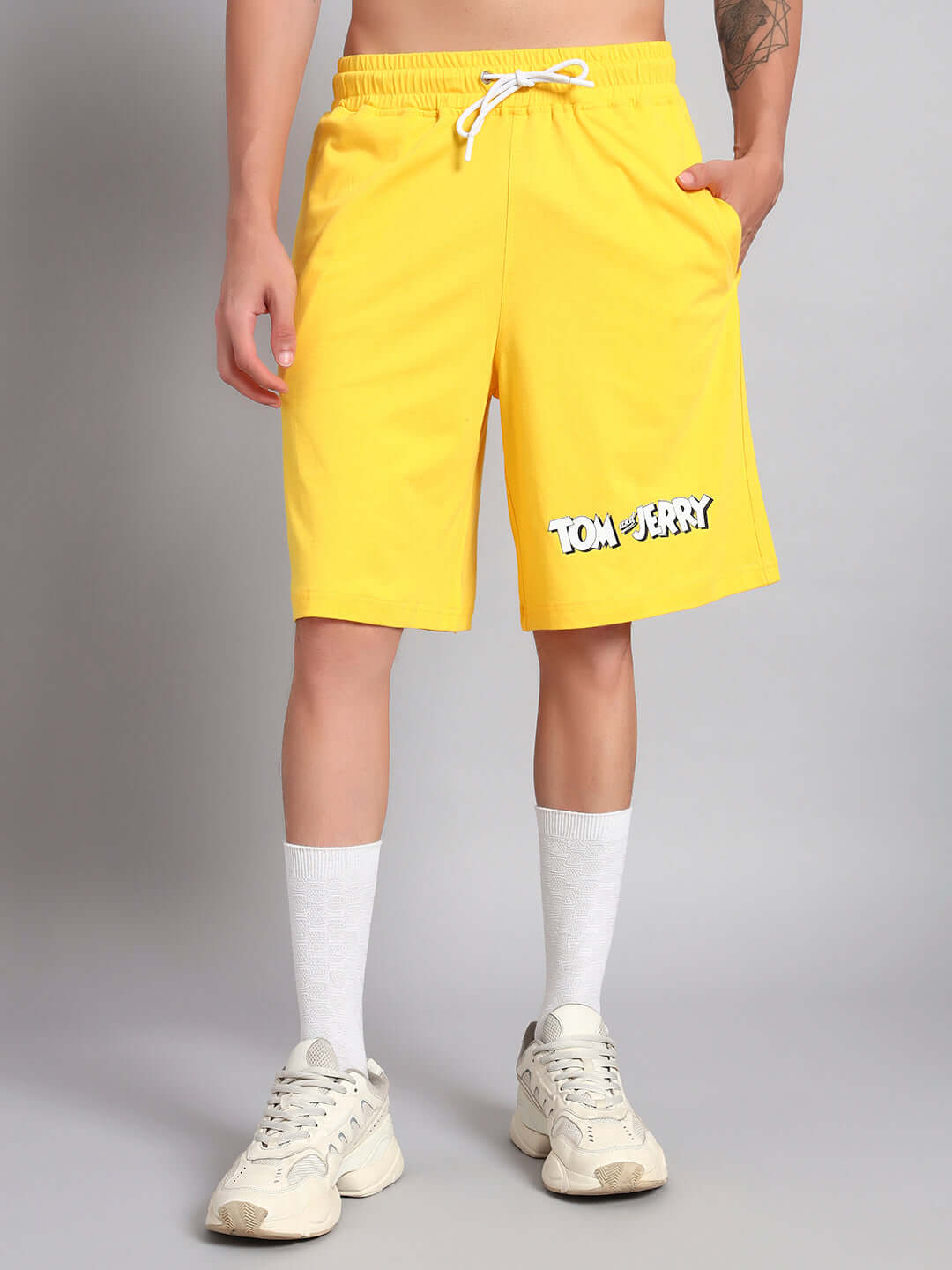 Yellow Tom & Jerry shorts for men, featuring premium cotton French terry fabric.