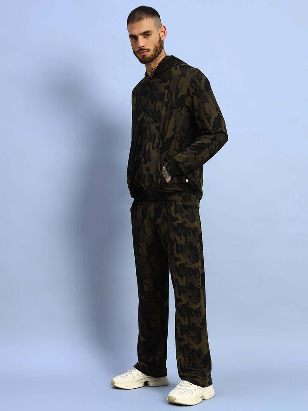 Model wearing Trench Relaxed Pant Jogger in camo green, showcasing a comfortable and stylish fit suitable for casual wear.