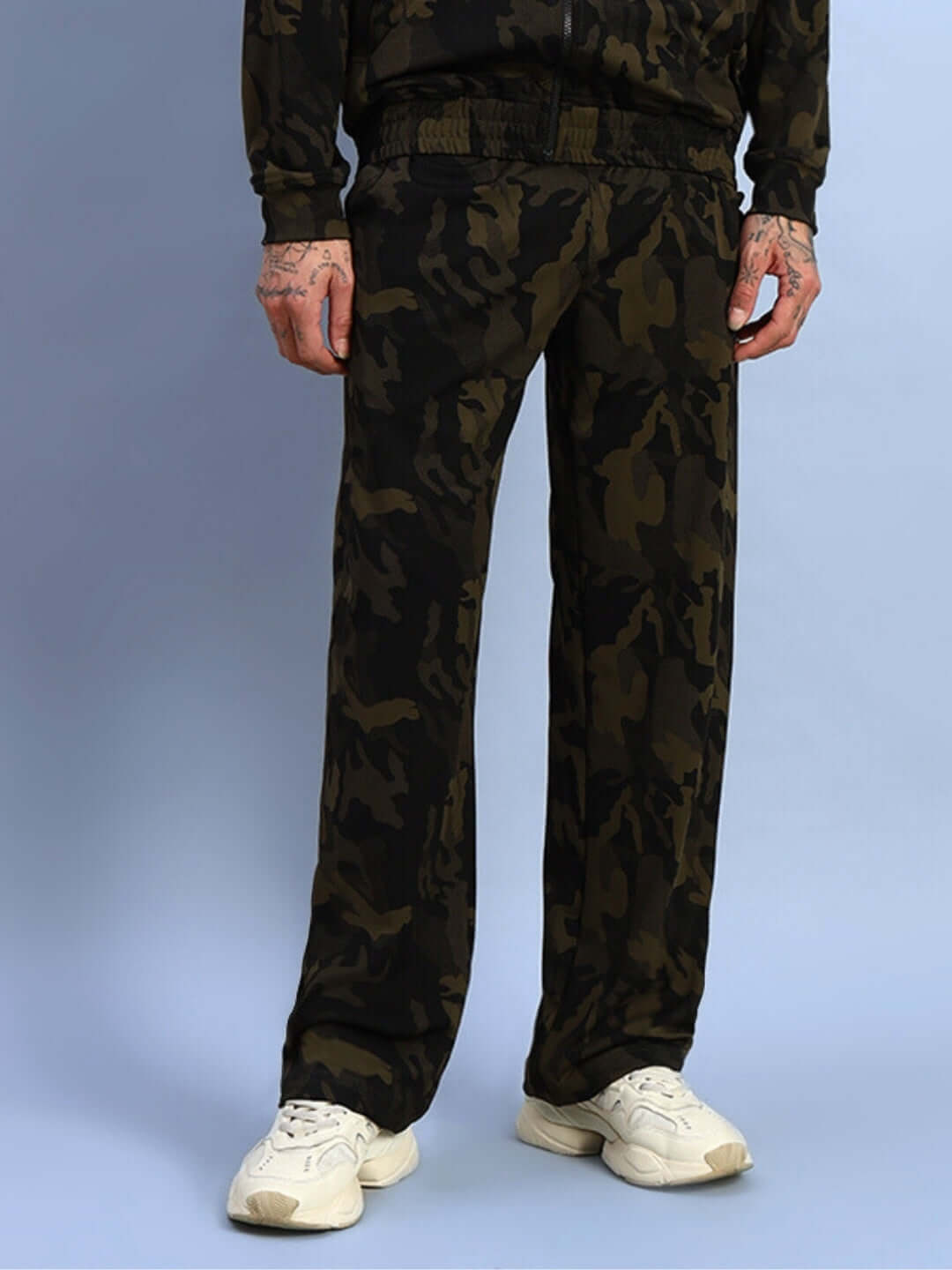 Model wearing camo green Trench Relaxed Pant Jogger by DUDS, showcasing a comfortable fit and stylish design. Made to order by skilled tailors.