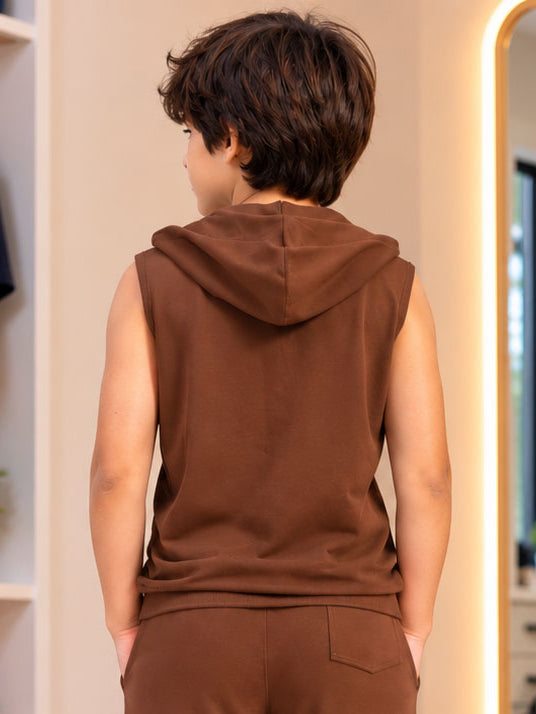TRIBAL SLEEVELESS HOODED T-SHIRT FOR BOYS GIRLS BROWN worn by kid, back view showing trendy hood and streetwear style design