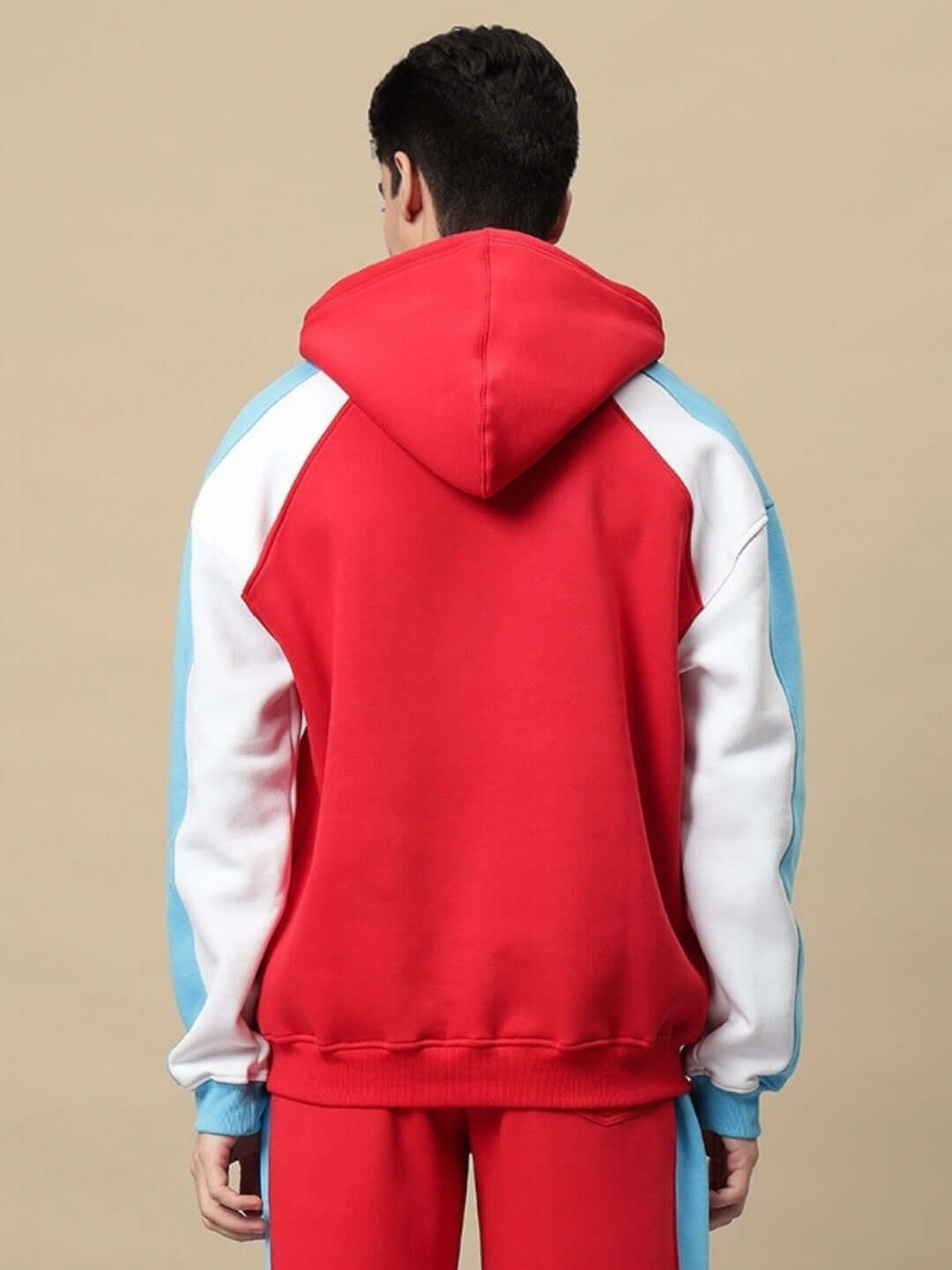 Back view of TRUNKIT FLEECE COLORBLOCK HOODIE RED, featuring vibrant colorblock design with red, blue, and white accents.