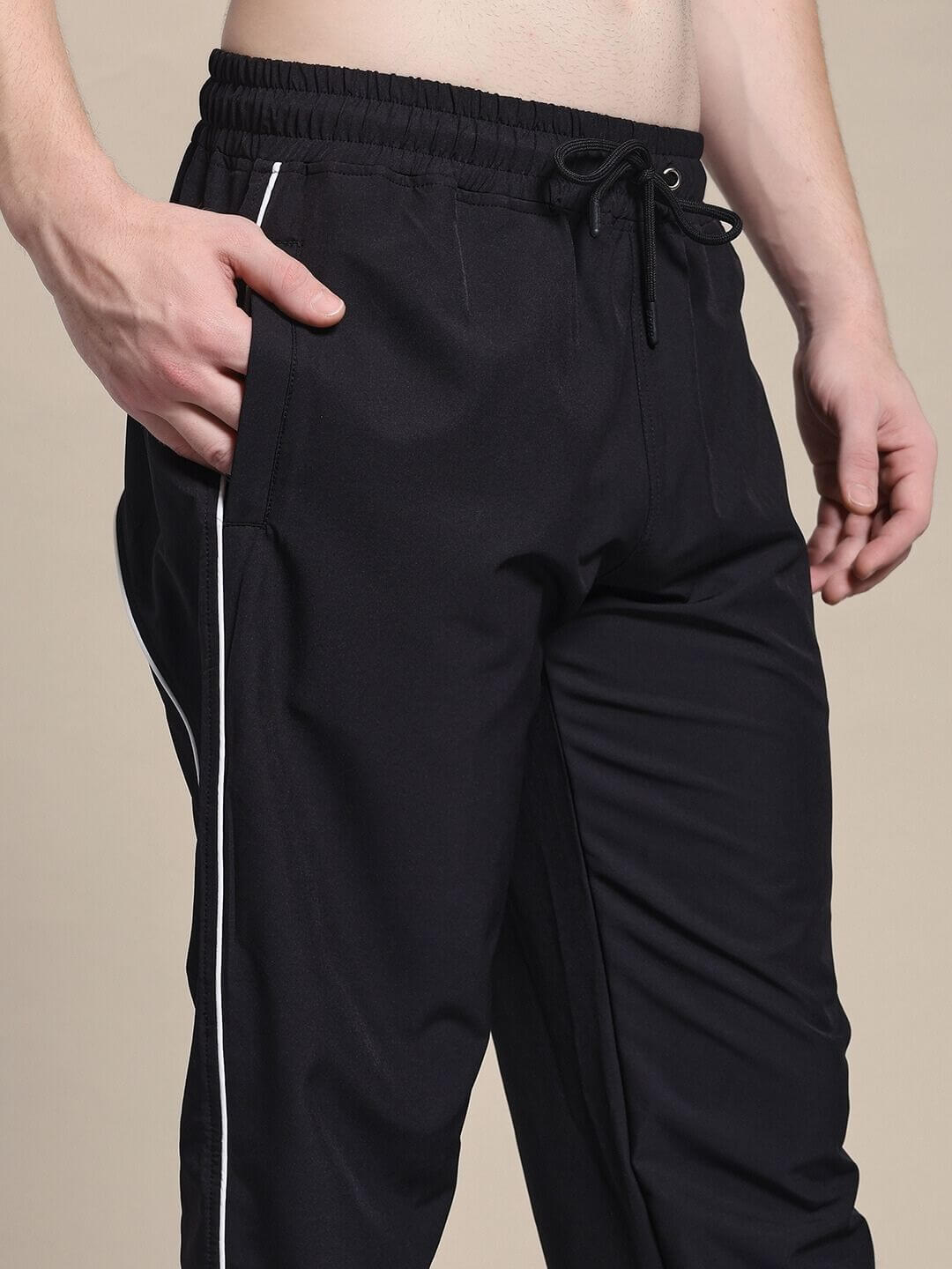TURBO TRACK RELAXED-FIT JOGGERS BLACK in premium cotton-blend fabric, showcasing modern streetwear style with a comfortable fit.