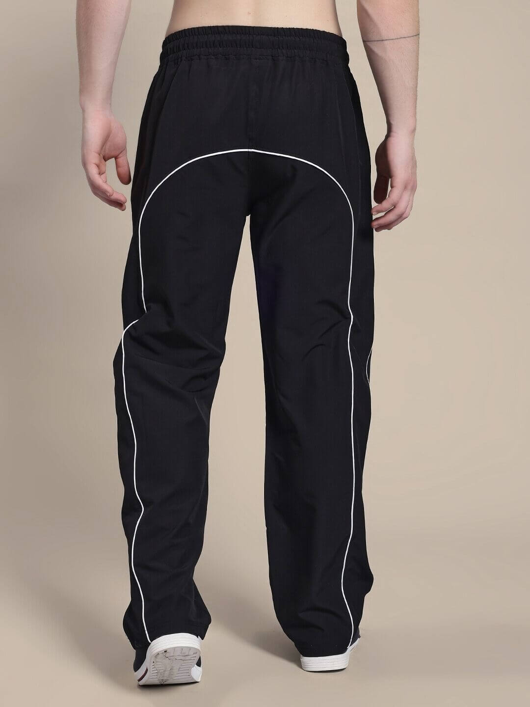 Back view of TURBO TRACK RELAXED-FIT JOGGERS BLACK with white contrast stitching, showcasing a comfortable and modern design.