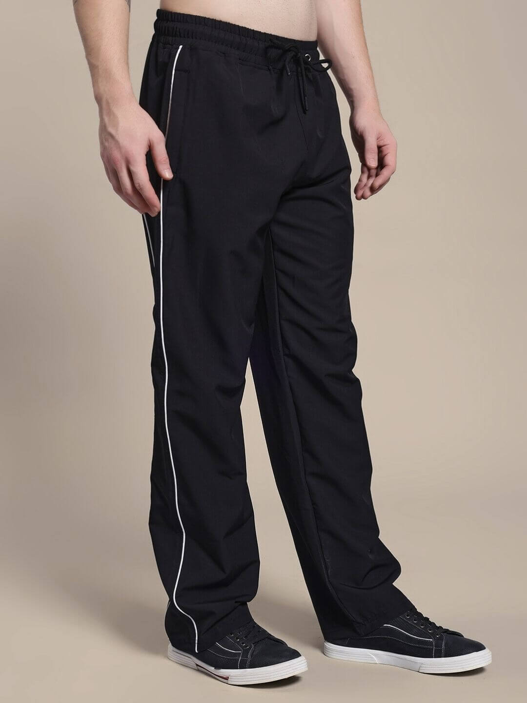 Model wearing TURBO TRACK RELAXED-FIT JOGGERS BLACK, showcasing streetwear comfort and modern style with a relaxed silhouette.
