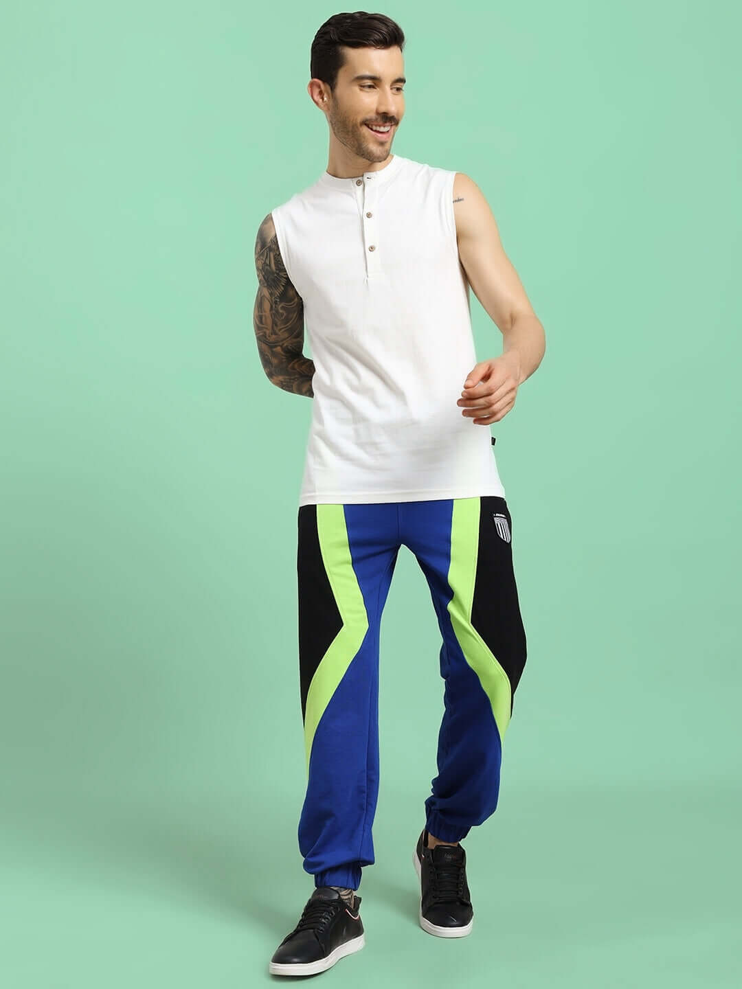 Model wears Ultra Colorblock Relaxed-Fit Joggers Blue-Black for bold streetwear style