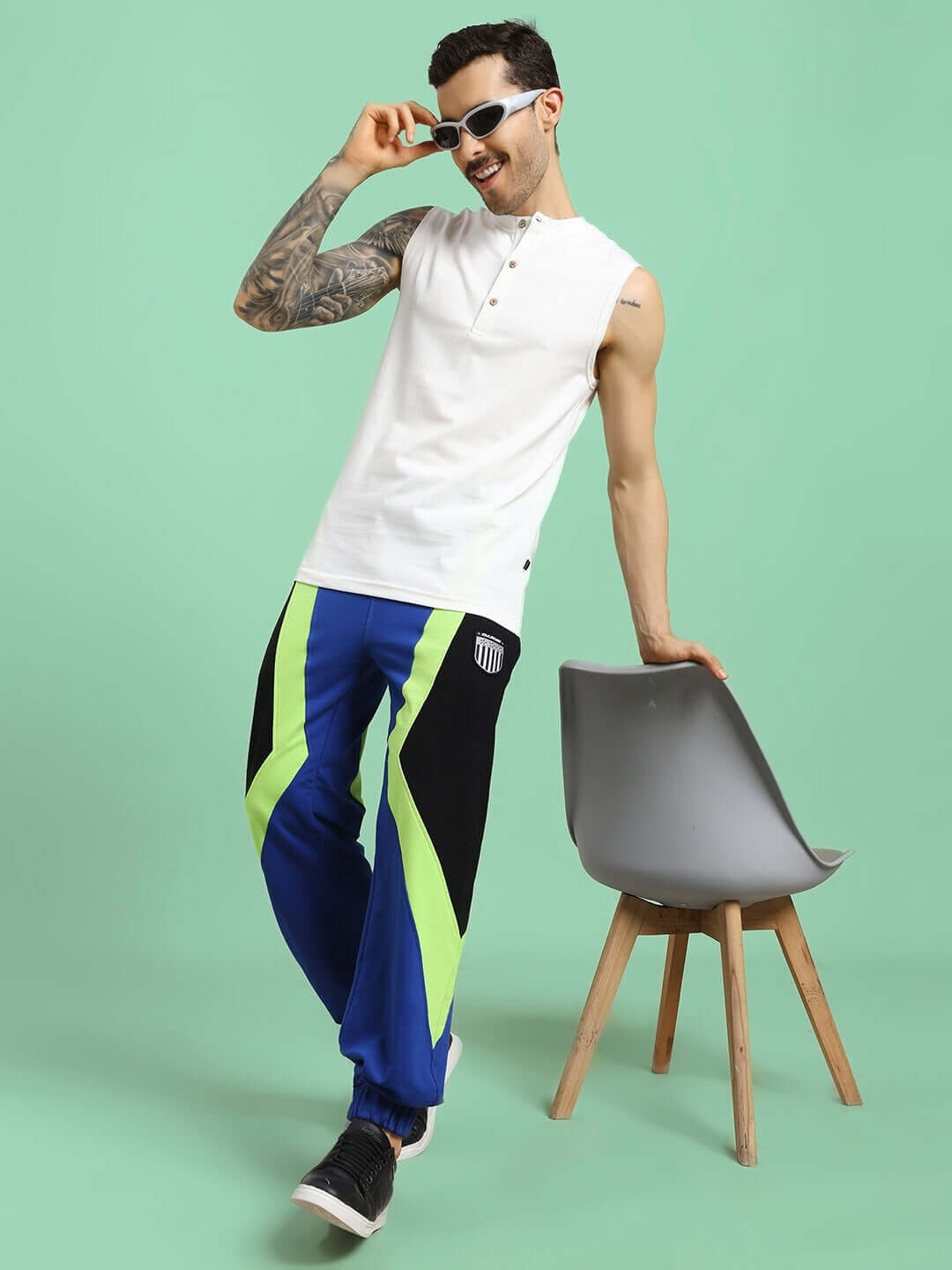 Model wearing ULTRA COLORBLOCK RELAXED-FIT JOGGERS BLUE-BLACK showcasing bold style and comfort, perfect for casual outings or workouts.