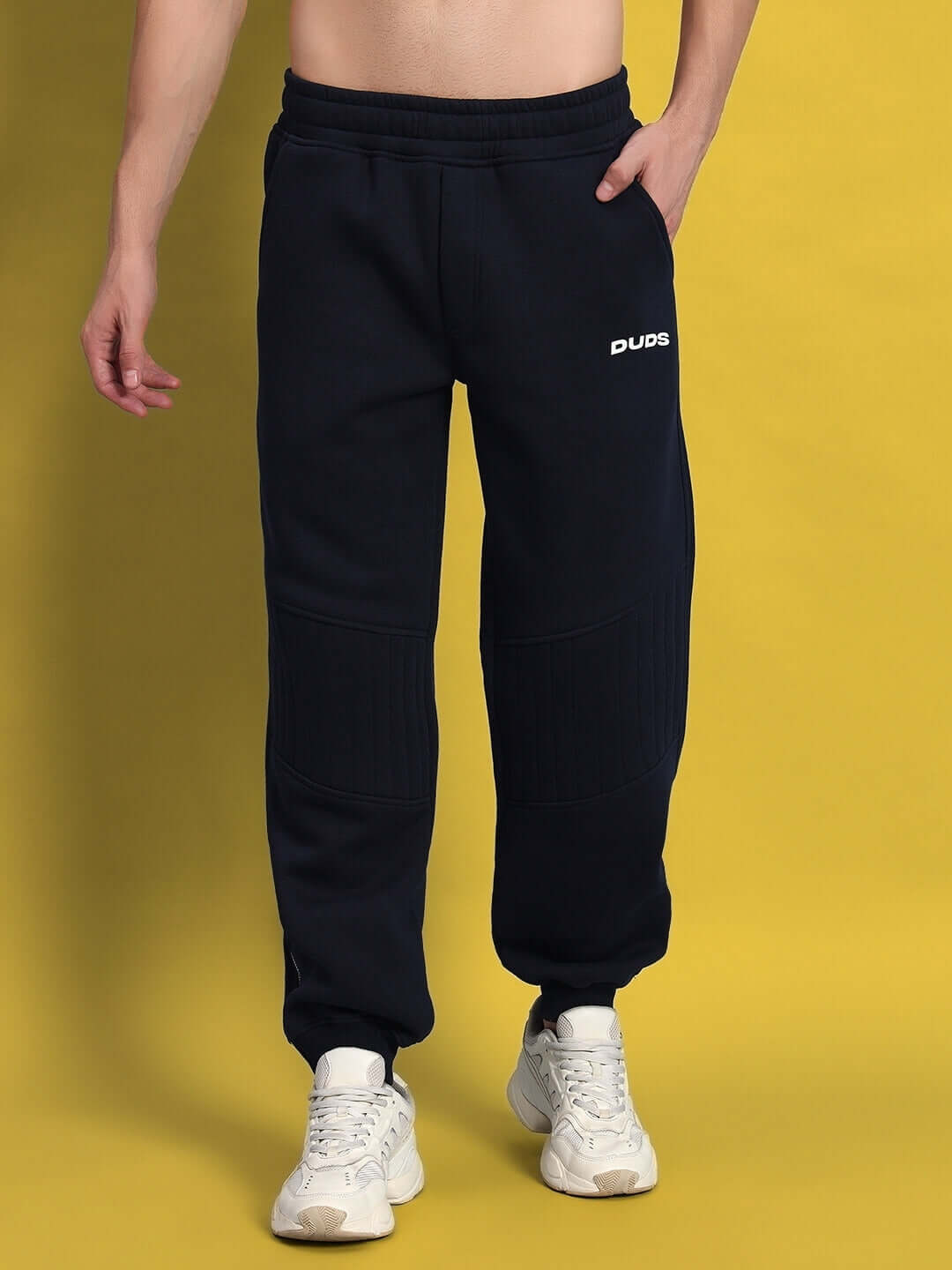Model wearing Fight Night Fleece Co-Ord Navy Blue sweatpants for unisex comfort and style