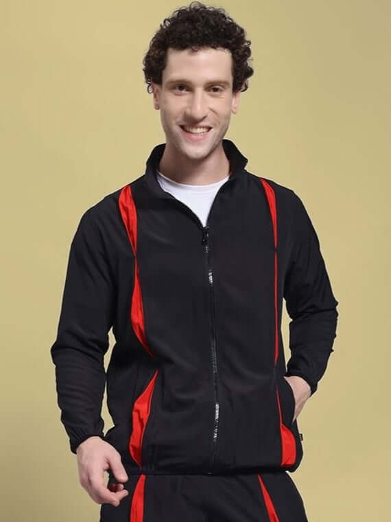 Man wearing UNISON RELAXED FIT JACKET BLACK RED with red accents, perfect for casual fashion and outdoor activities.