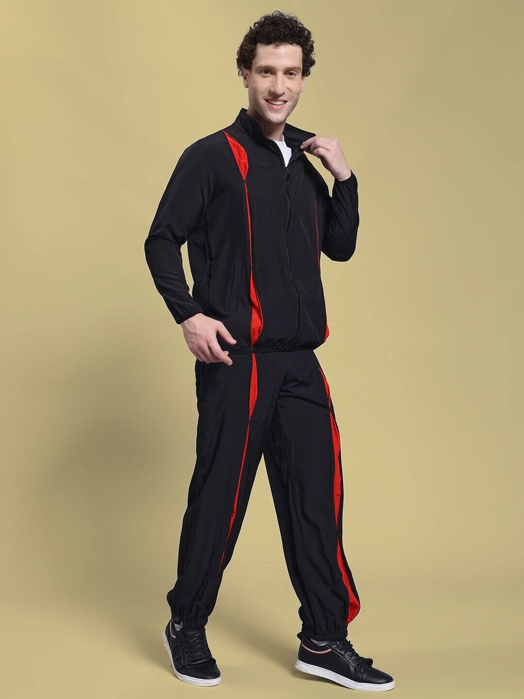Man wearing UNISON RELAXED FIT CO-ORD SET BLACK RED with black and red design, showcasing relaxed fit fashion for children.