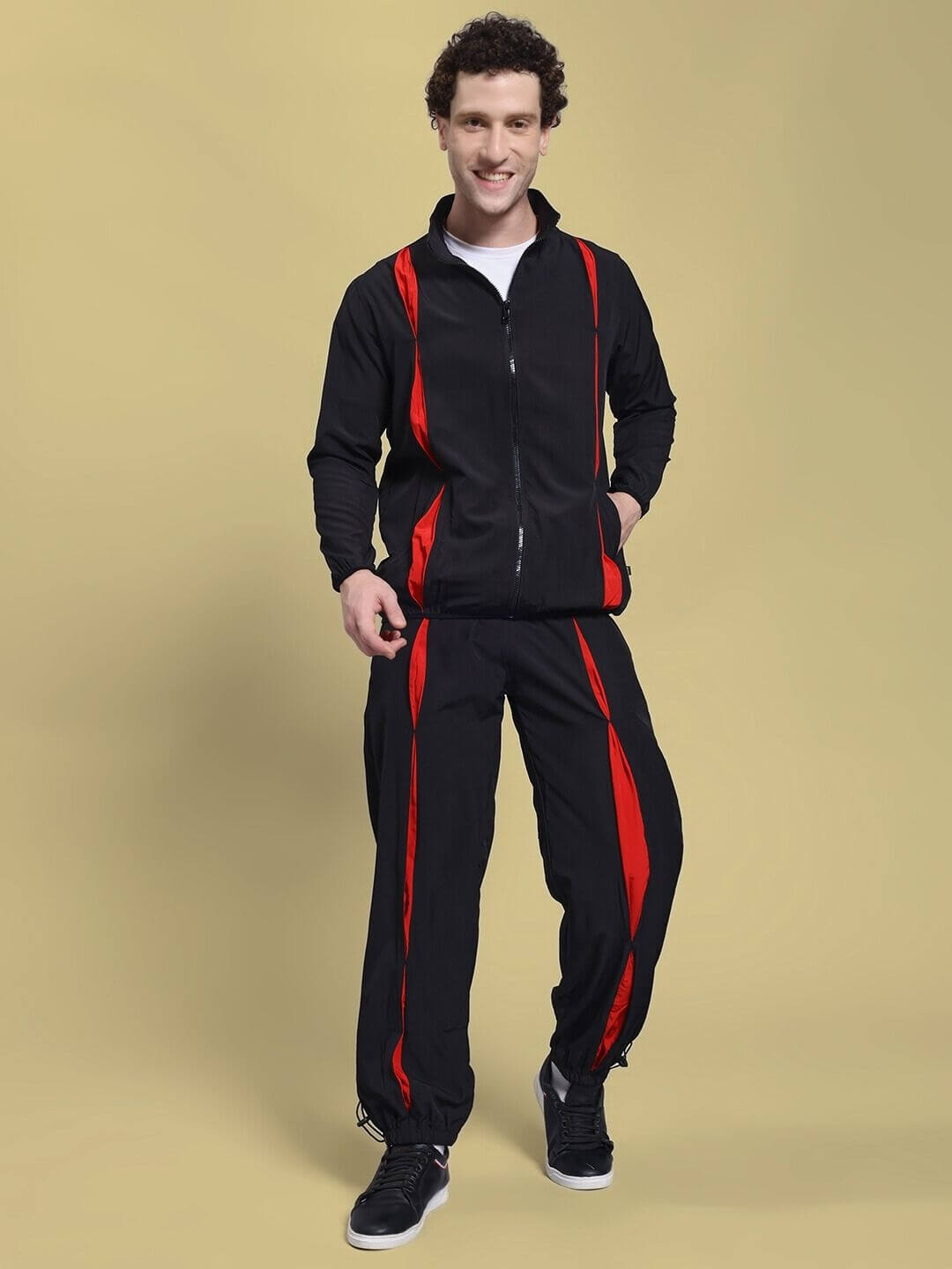 Person wearing UNISON RELAXED FIT CO-ORD SET BLACK RED, a stylish co-ord with a relaxed-fit sweatshirt and joggers.