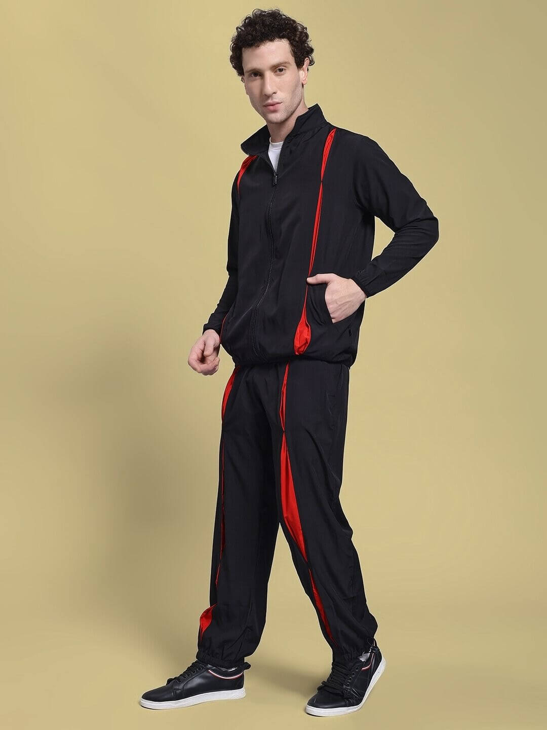 Man wearing UNISON RELAXED FIT CO-ORD SET BLACK RED, showcasing stylish and comfortable casual fashion for versatile occasions.