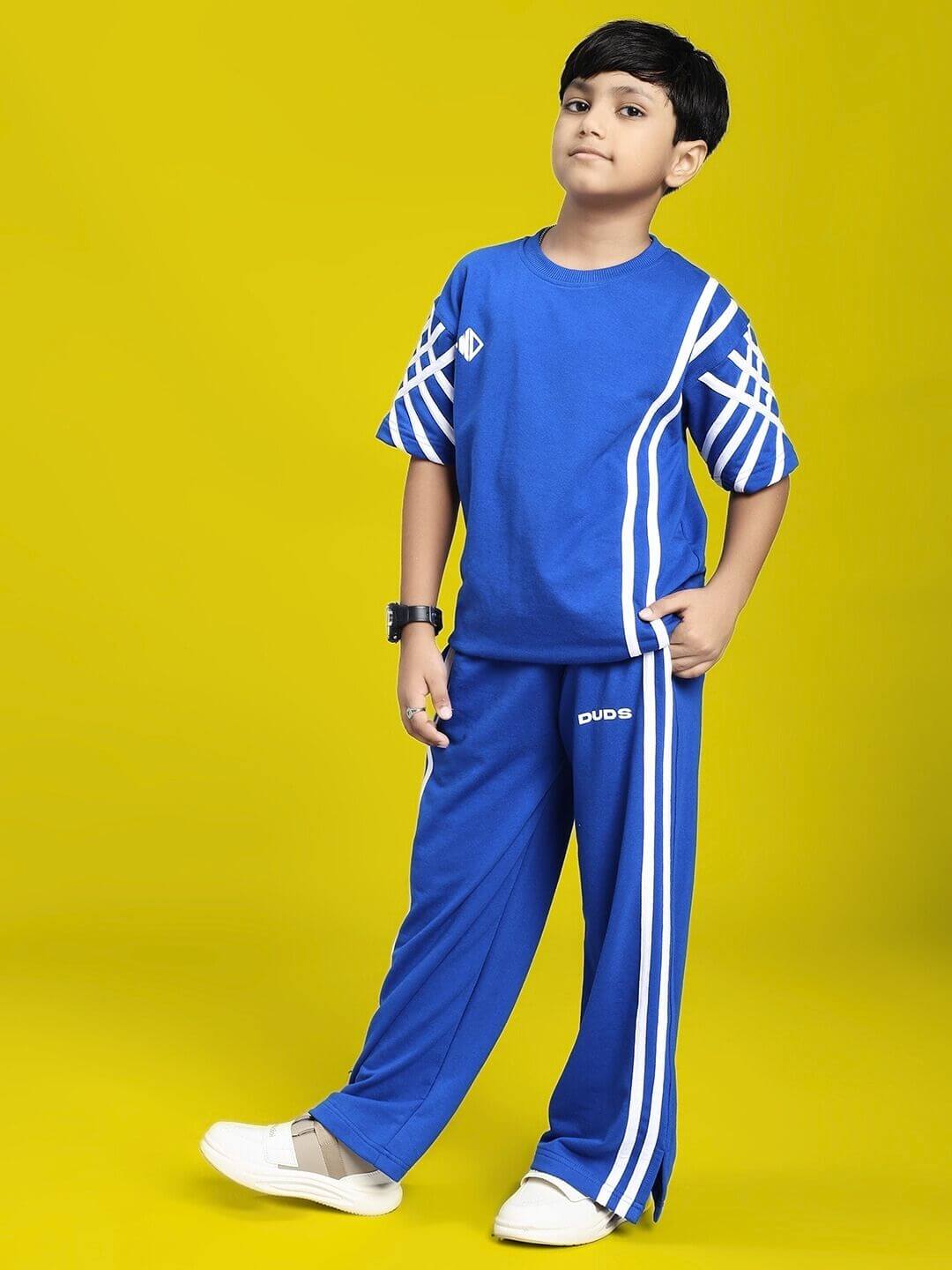 UNITED STRIPE CO-ORD SET FOR BOYS GIRLS BLUE modeled by young child in stylish pose