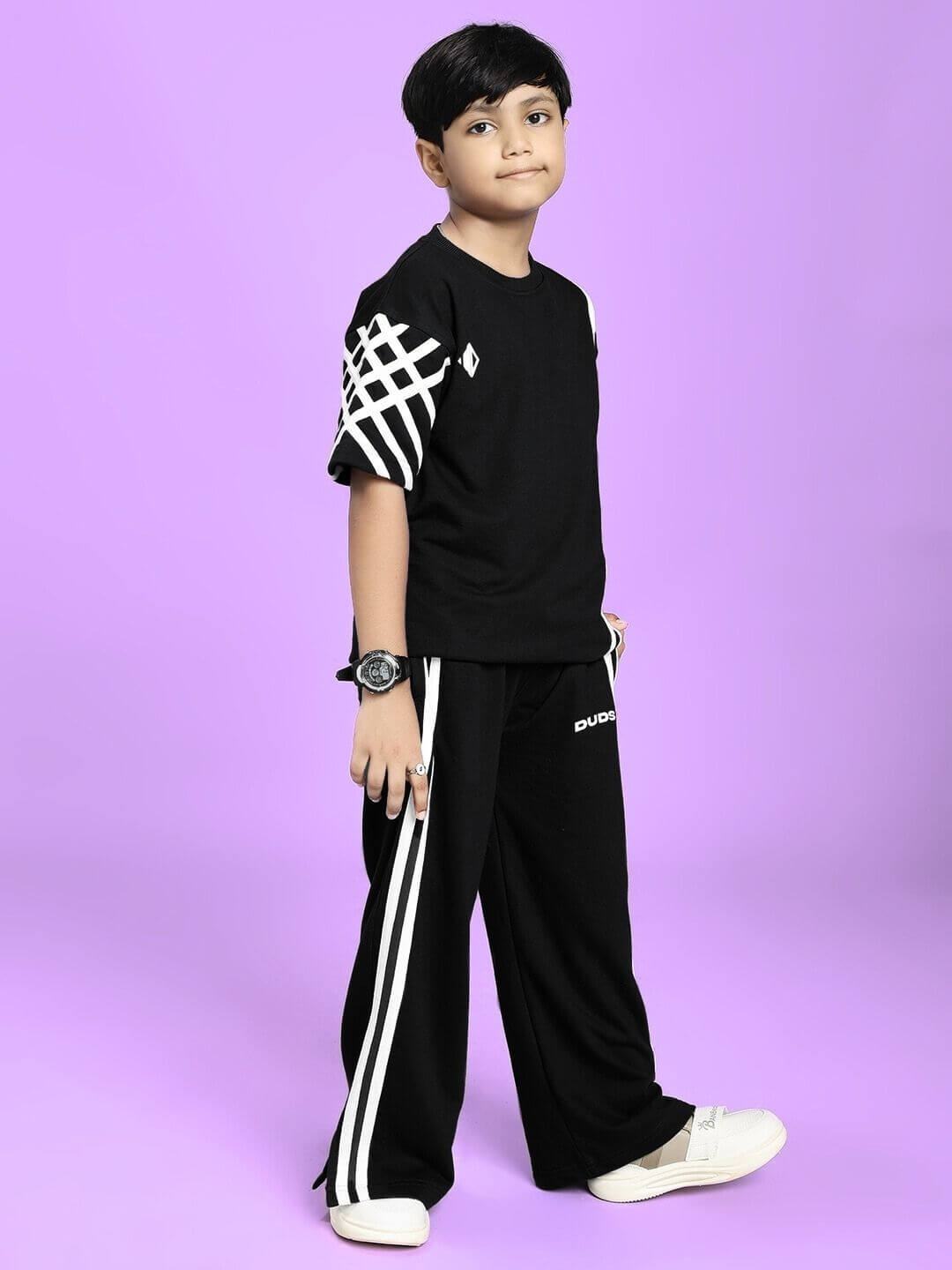 UNITED STRIPE CO-ORD SET FOR BOYS GIRLS BLACK with sporty stripe details on black fabric, perfect for active kids' fashion.