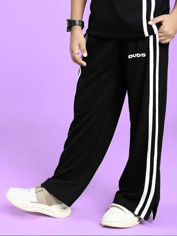UNITED STRIPE JOGGER FOR BOYS AND GIRLS BLACK with bold white stripes, perfect for kids' comfort and style.