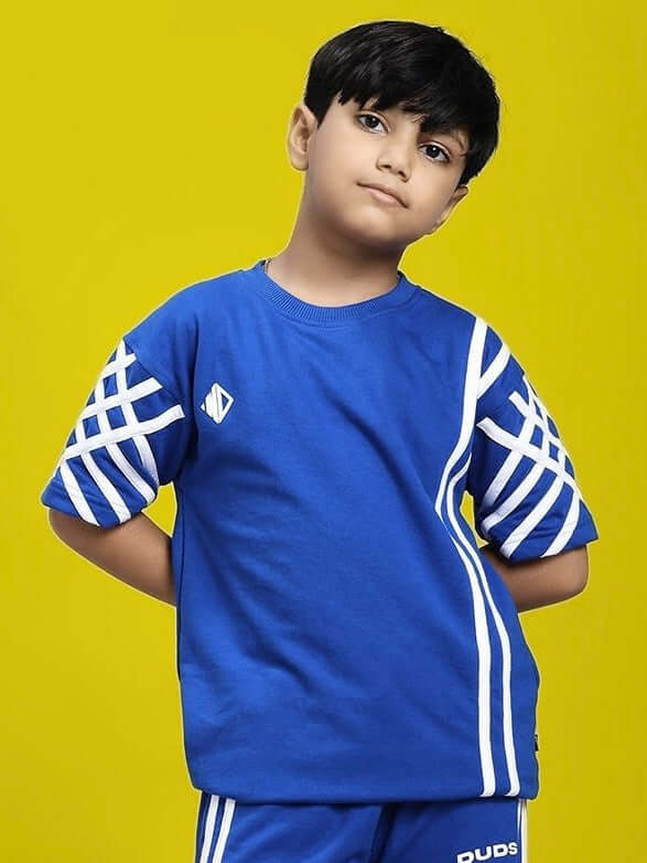 Child wearing UNITED STRIPE T-SHIRT FOR BOYS AND GIRLS BLUE on yellow background