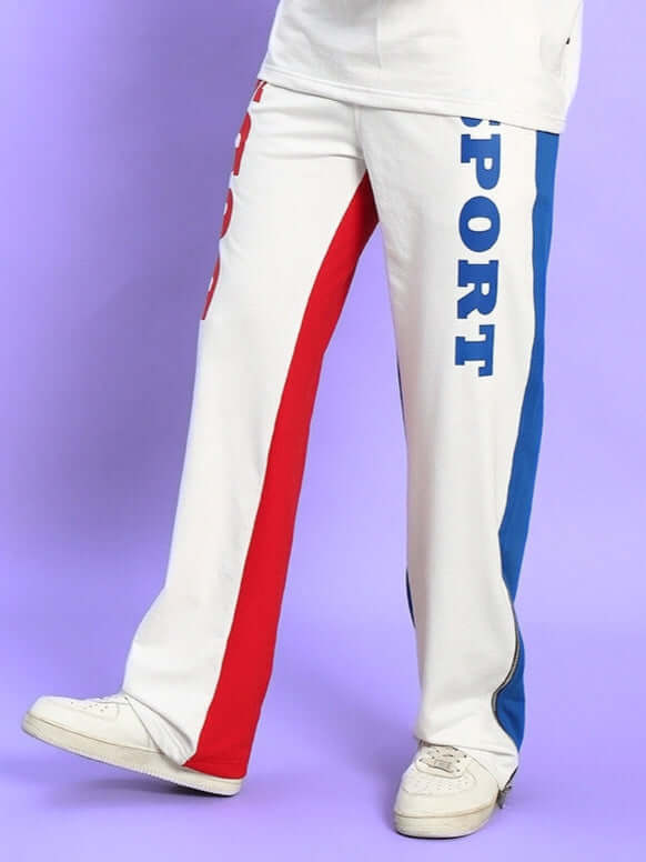 URBAN DRIFT Relaxed Fit Joggers in White Multi with colorful stripes, comfortable wide-leg design, paired with casual white sneakers.