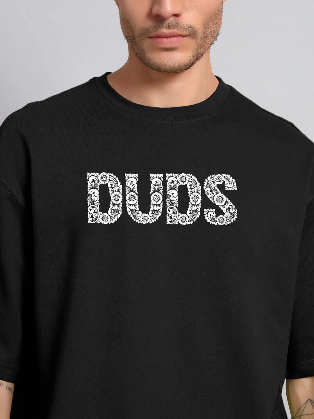 URBAN PETAL OVERSIZED T-SHIRT BLACK with floral graphic design on front, worn by a model.