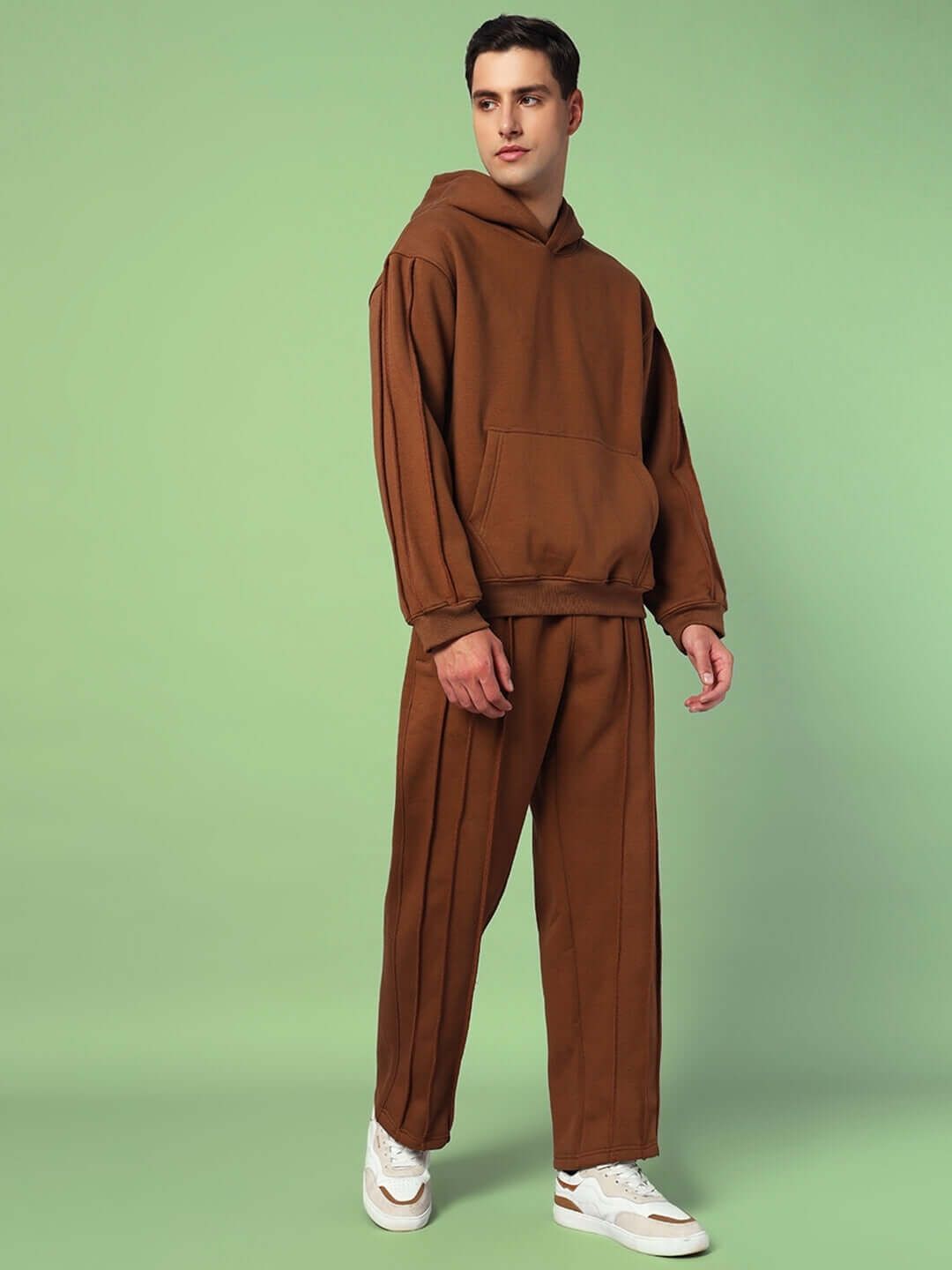 Model wearing URBAN SOLID PLATED FLEECE CO-ORD BROWN, featuring a hoodie and joggers for a stylish urban look.