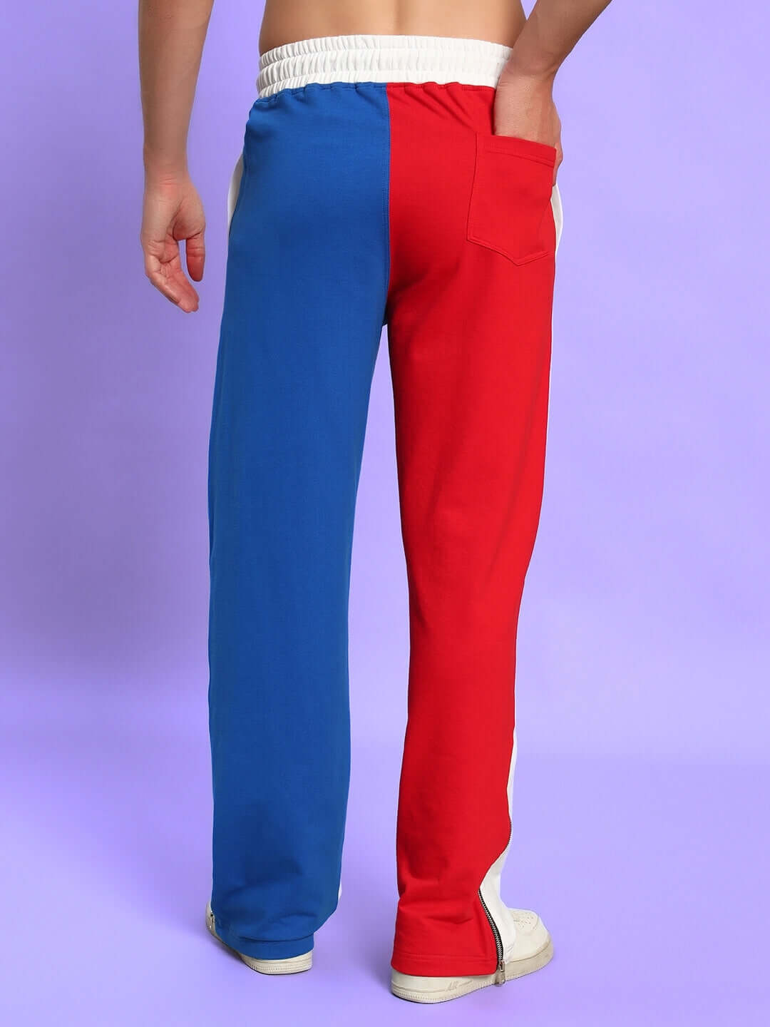Back view of URBAN DRIFT relaxed fit joggers in white multi-color, worn by a model; features red and blue color blocks with white accents.