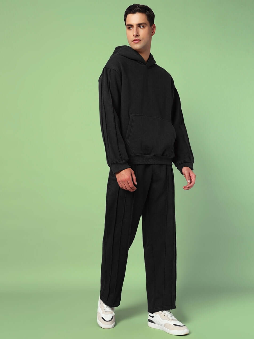 Model wearing URBAN SOLID PLATED FLEECE CO-ORD BLACK featuring a hoodie and joggers for streetwear style