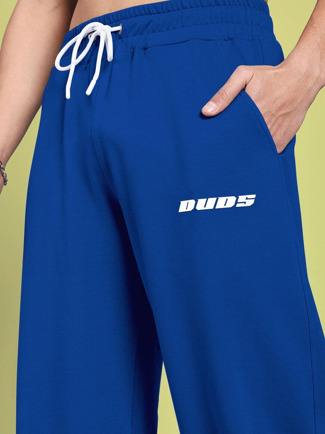 alt_tag: Close-up of blue Vanilla Relaxed-Fit Joggers by DUDS, showcasing adjustable drawstring and logo detail.