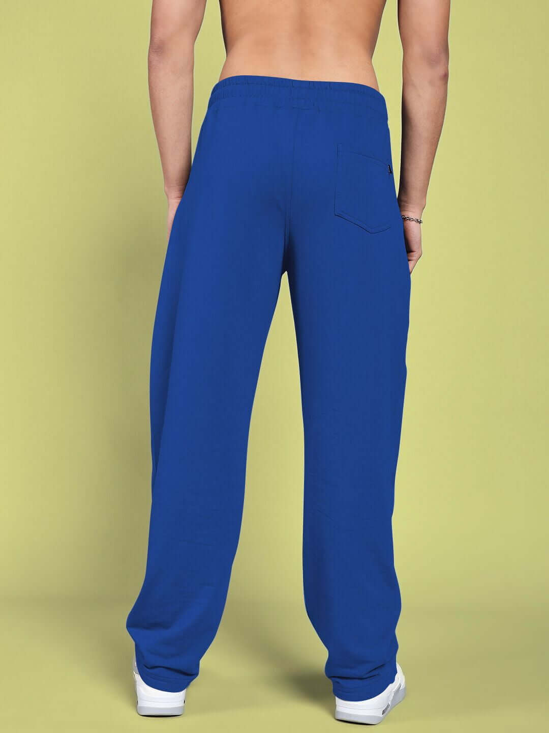 Blue relaxed-fit joggers for men, shown from the back, featuring a casual style and comfortable fabric.