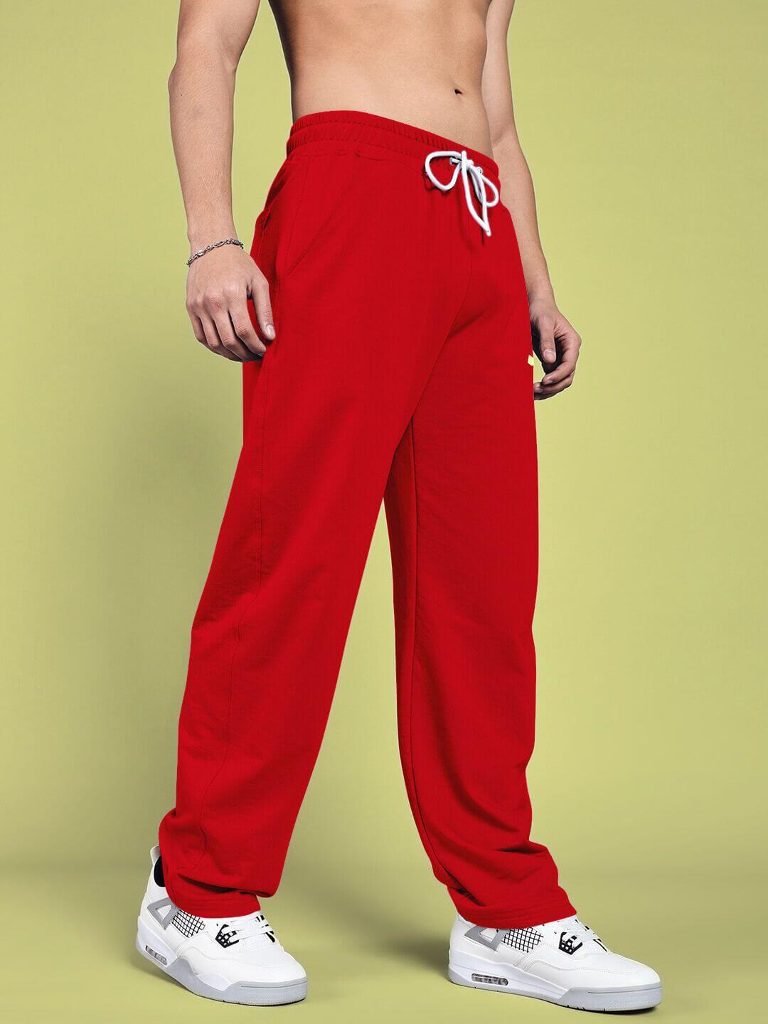 Person wearing vanilla relaxed-fit red joggers, showcasing comfortable fit and style, ideal for custom size options.