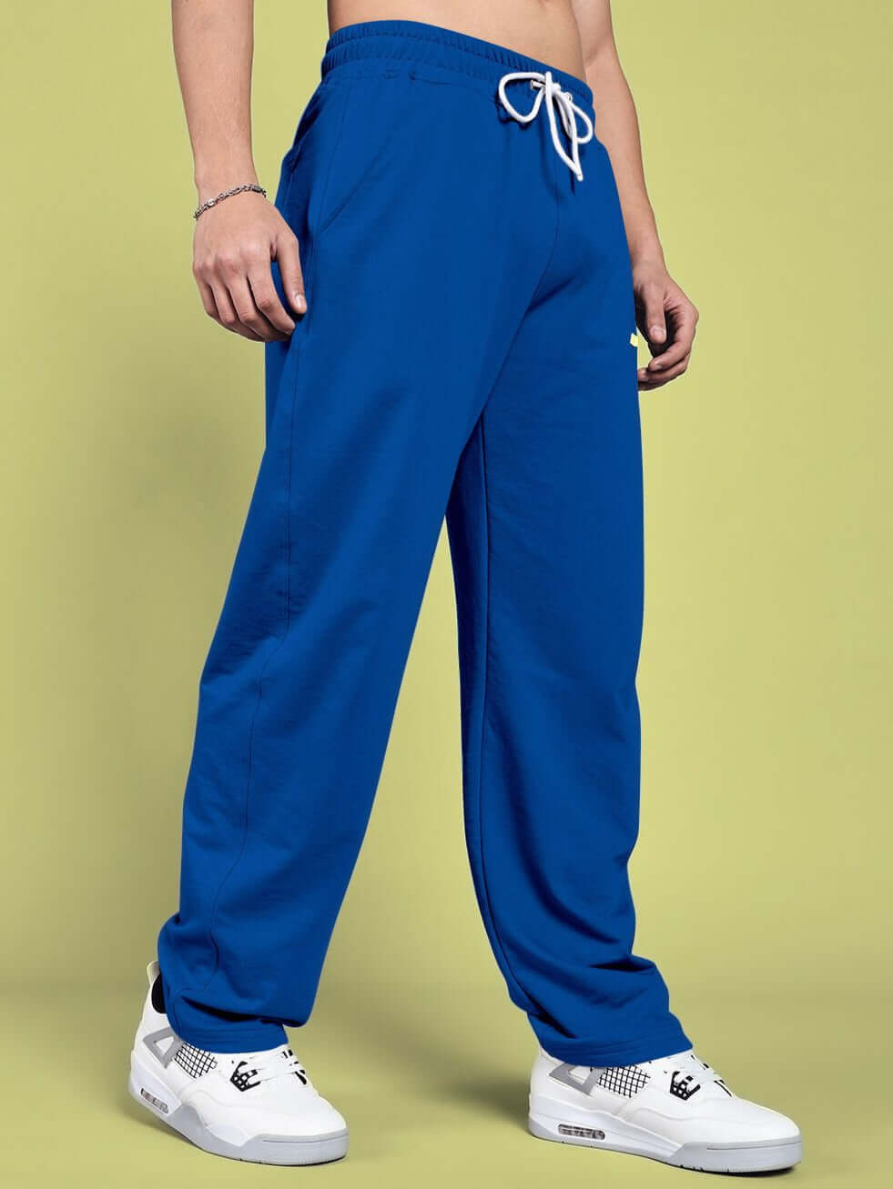 Person wearing blue vanilla relaxed-fit joggers showcasing comfortable and stylish casual wear.