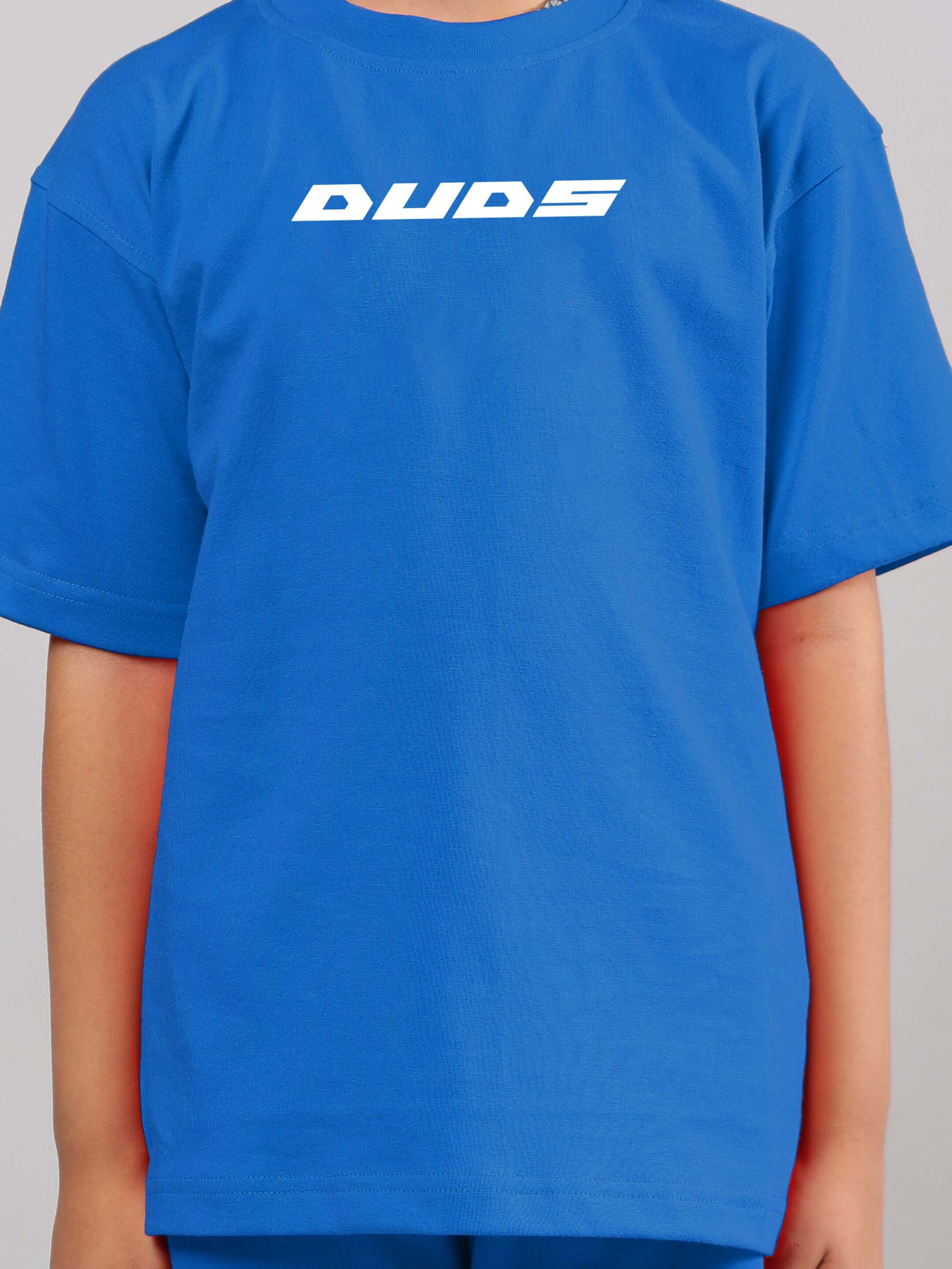 Child wearing a blue DUDS Victory Co-Ord T-shirt, suitable for boys and girls, made with quality craftsmanship.