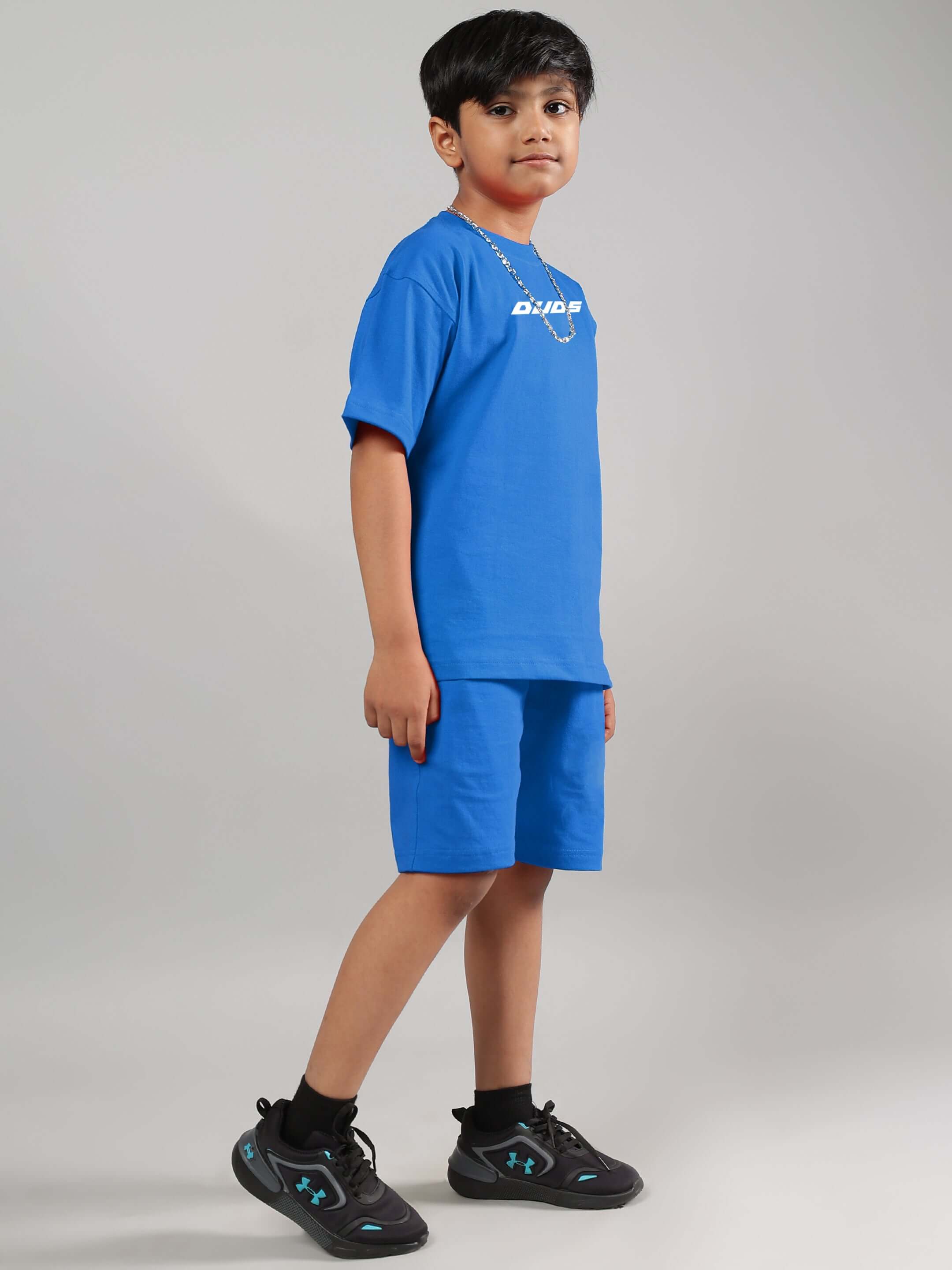 Child wearing VICTORY CO-ORD in R-Blue, featuring a stylish blue shirt and shorts set by DUDS, suitable for boys and girls.