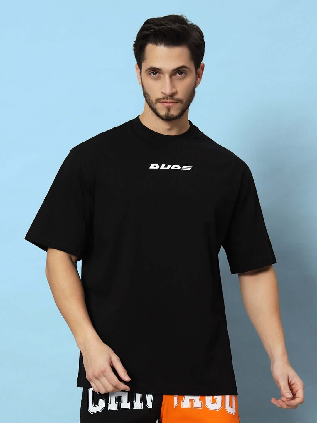 VICTORY black oversized t-shirt worn by model, customizable for custom fit, available for prepaid orders, stylish and comfortable design.