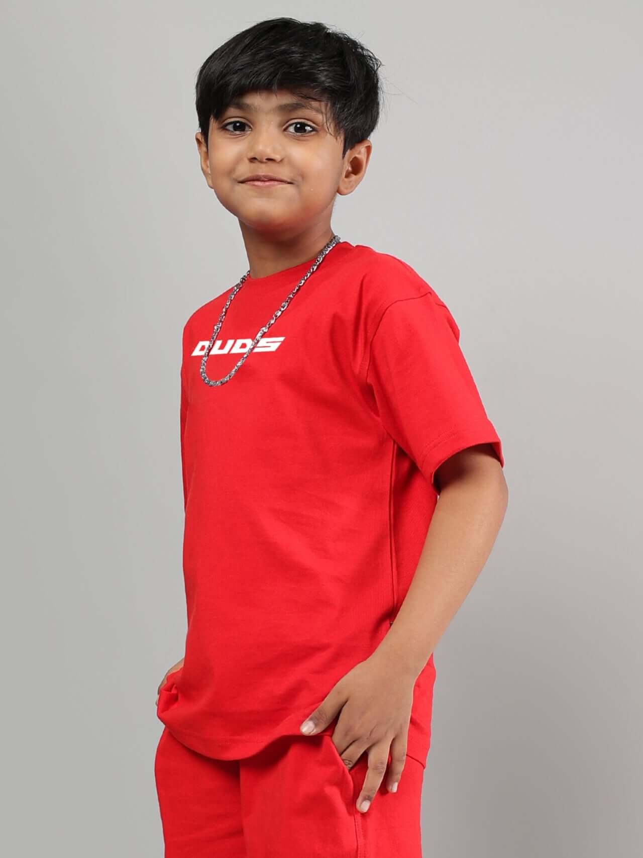 Red Victory T-shirt for boys and girls with DUDS logo, worn by a young model, customizable fit available; ideal casual wear for kids.