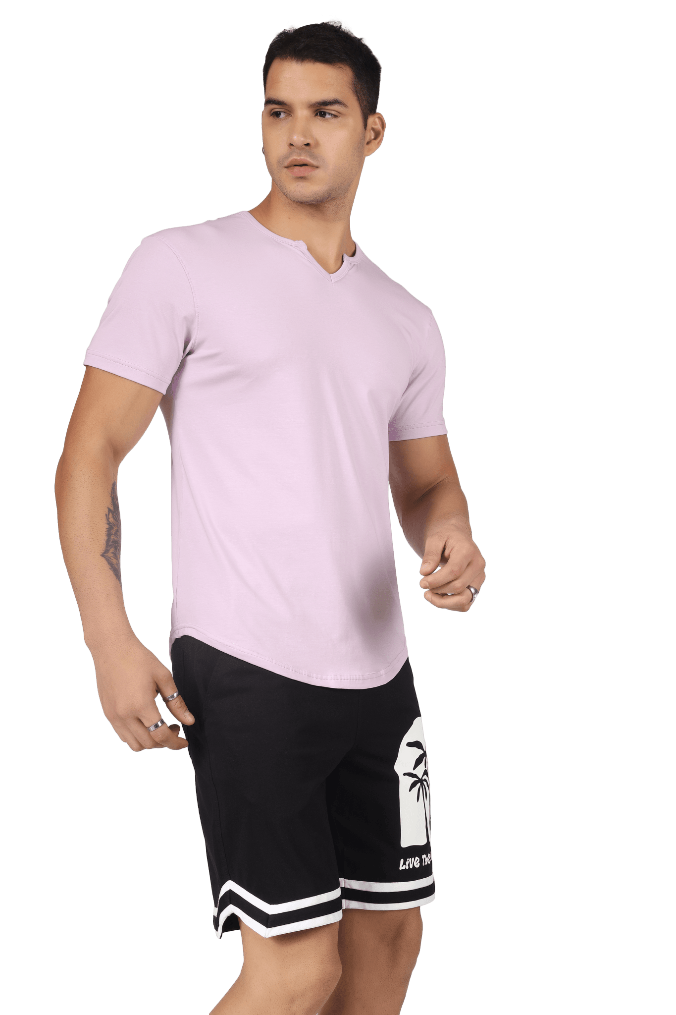 Man wearing VIKING REGULAR FIT T-SHIRT LILAC with black shorts, showcasing a casual and confident look.