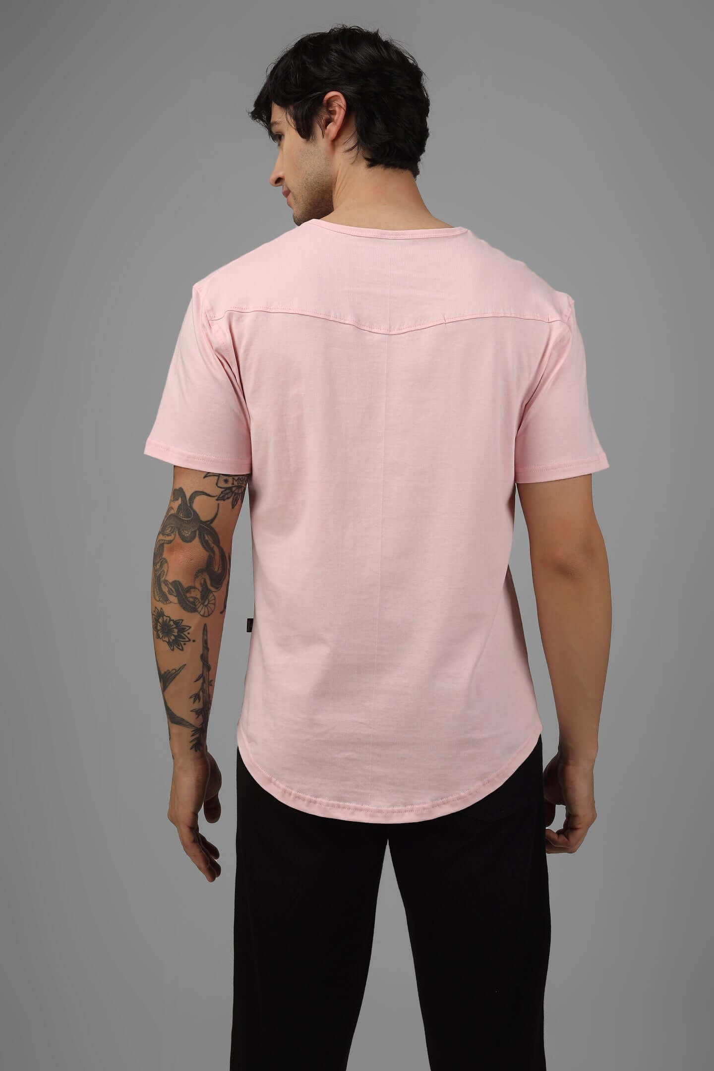 Back view of man wearing Viking Regular Fit T-shirt in baby pink, 100% cotton, bio-washed, designed by Color By Colours, stylish and comfortable.