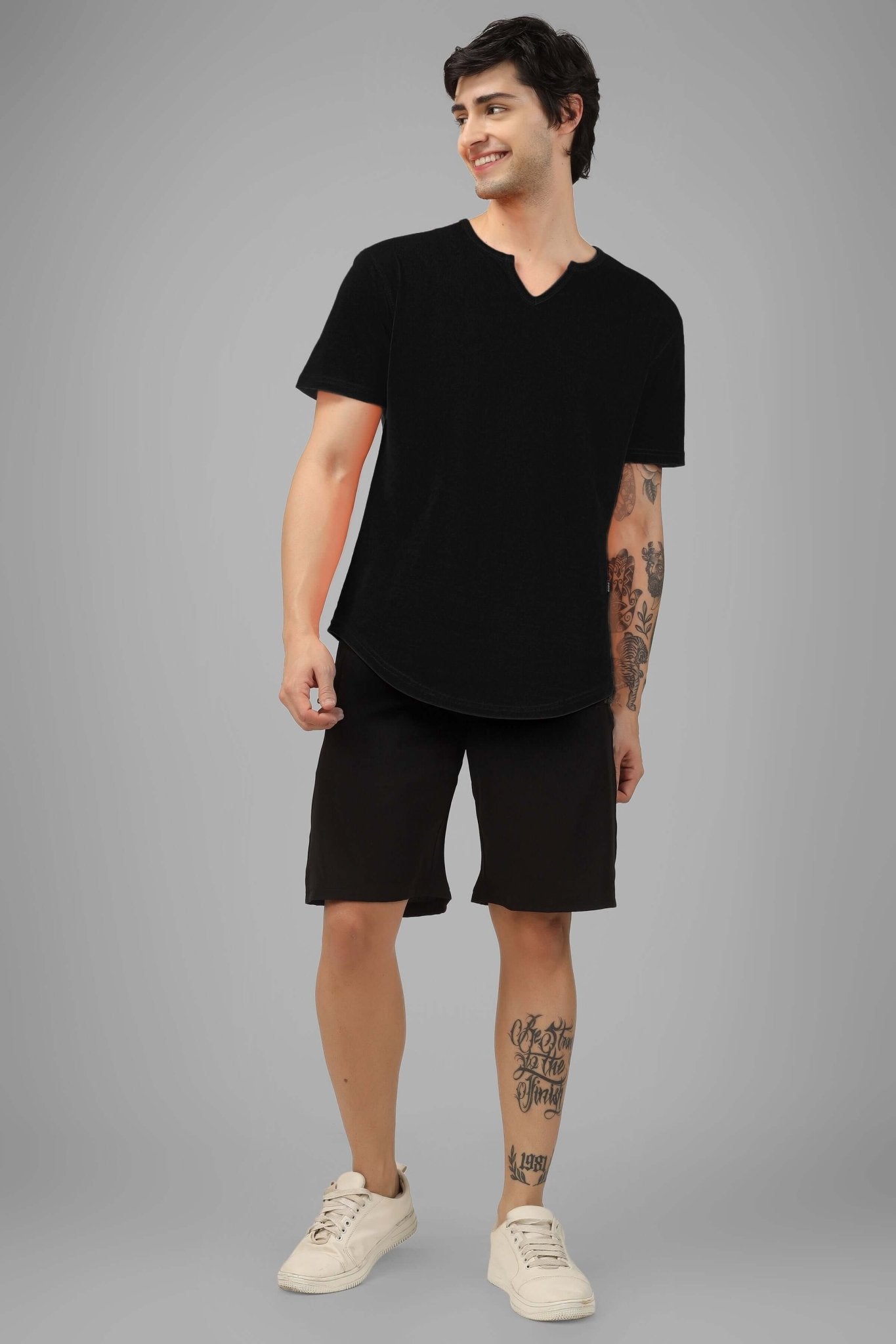 Man wearing VIKING REGULAR FIT T-SHIRT BLACK, showcasing relaxed style and comfort.
