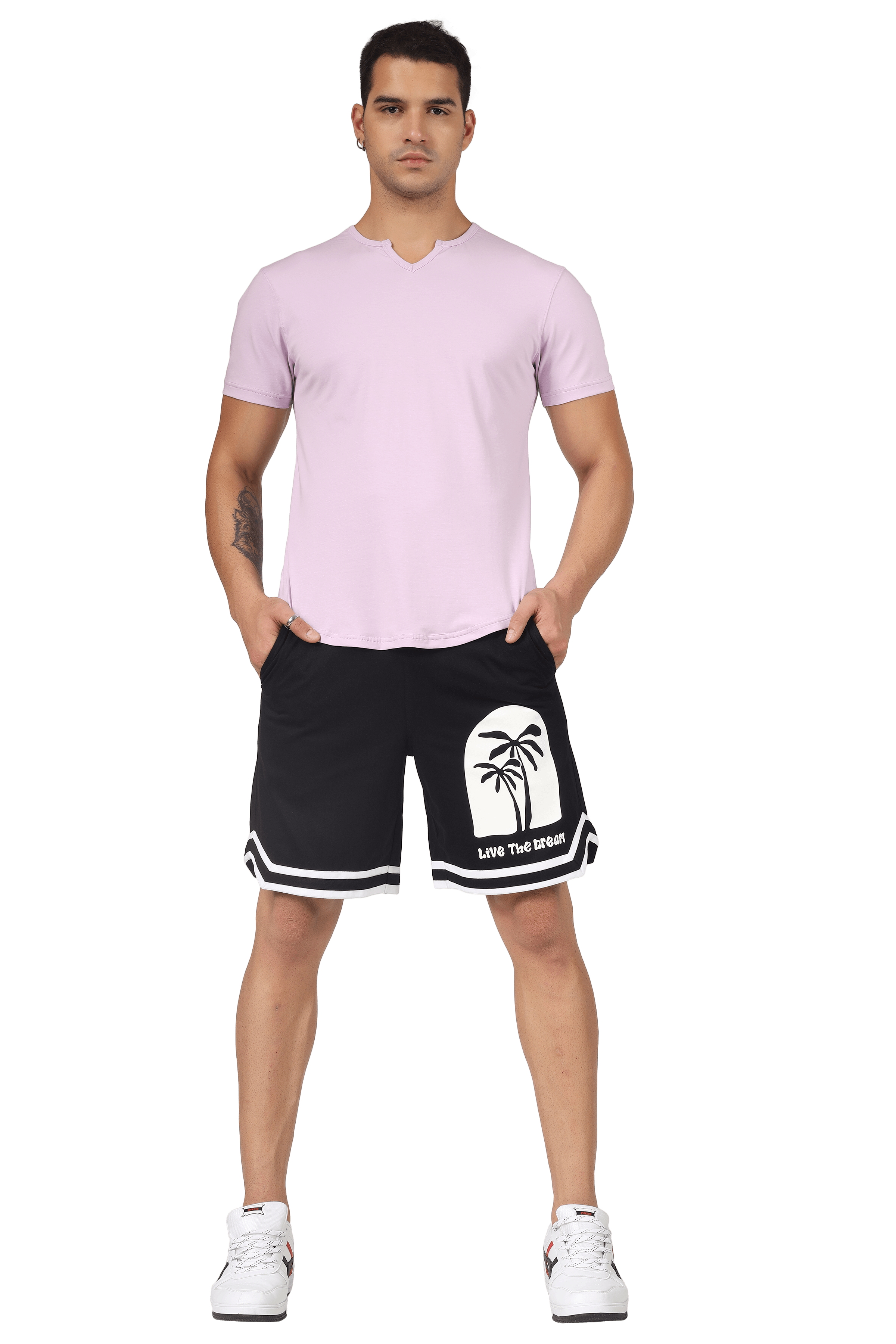 Man wearing VIKING REGULAR FIT T-SHIRT LILAC with black shorts featuring palm tree design, showcasing stylish and comfortable apparel.