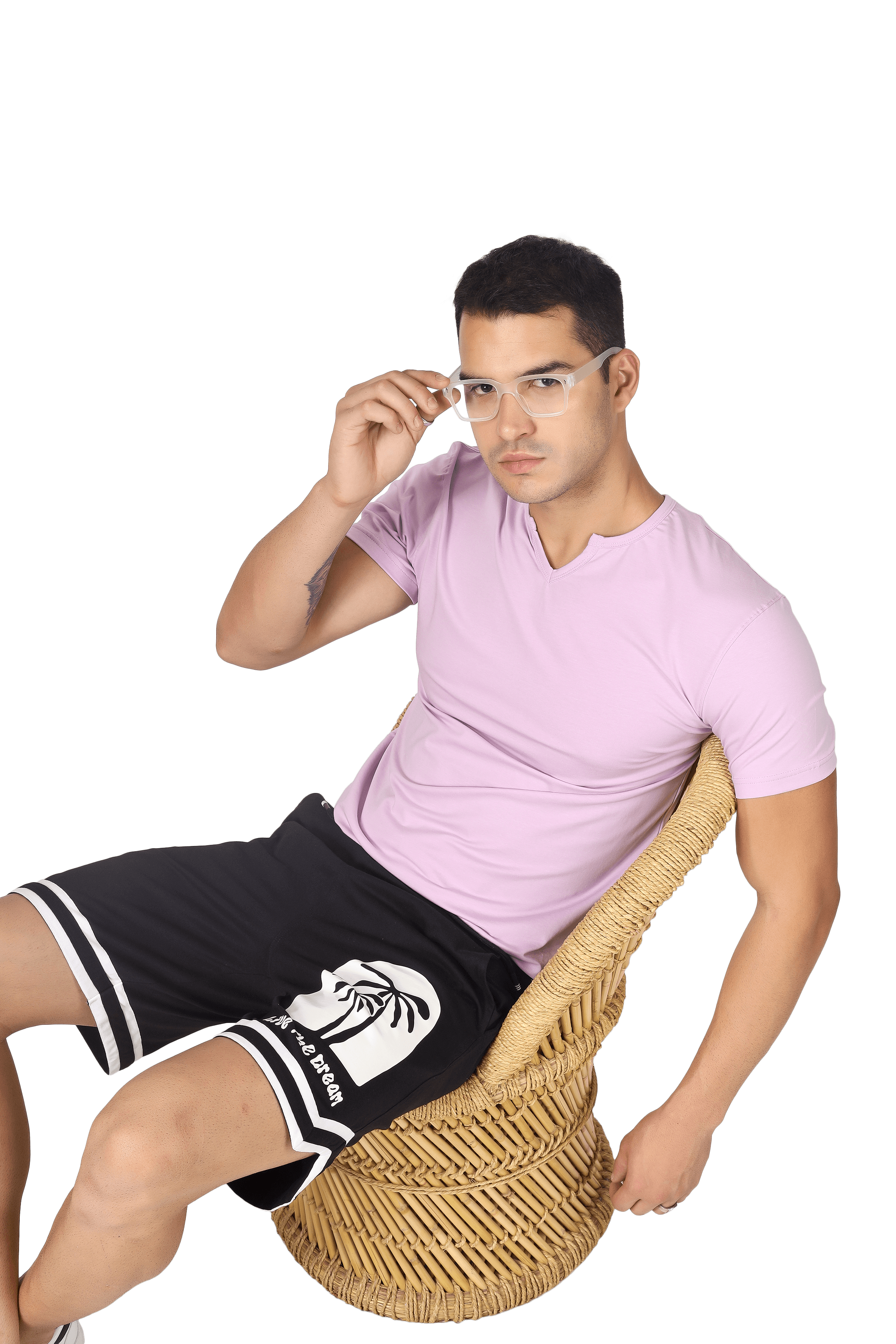 Man wearing VIKING REGULAR FIT T-SHIRT LILAC seated, showcasing modern style and comfort.