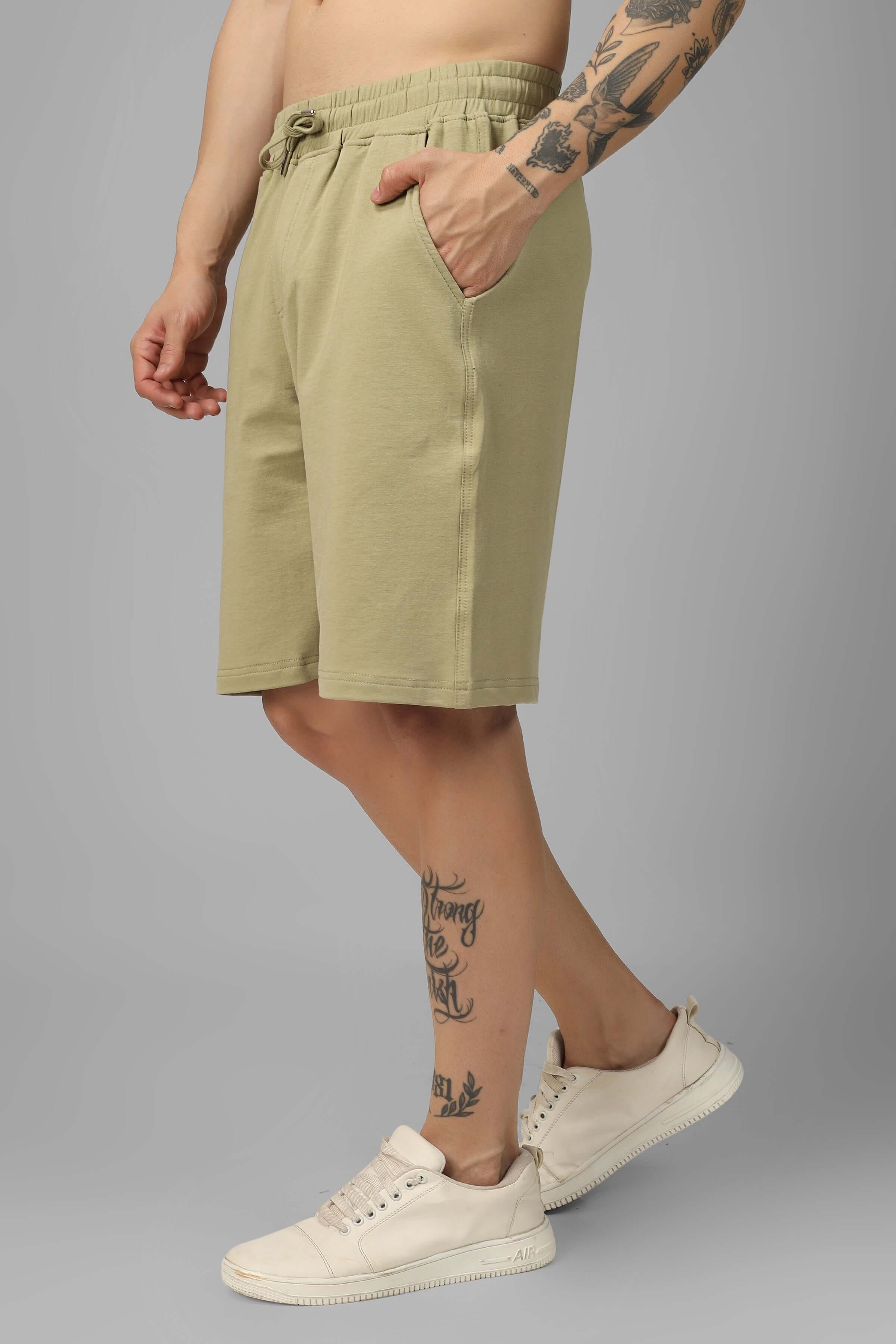 Vintage regular fit shorts in gravel green worn by model, showcasing custom fit option for prepaid orders, ideal for casual wear.