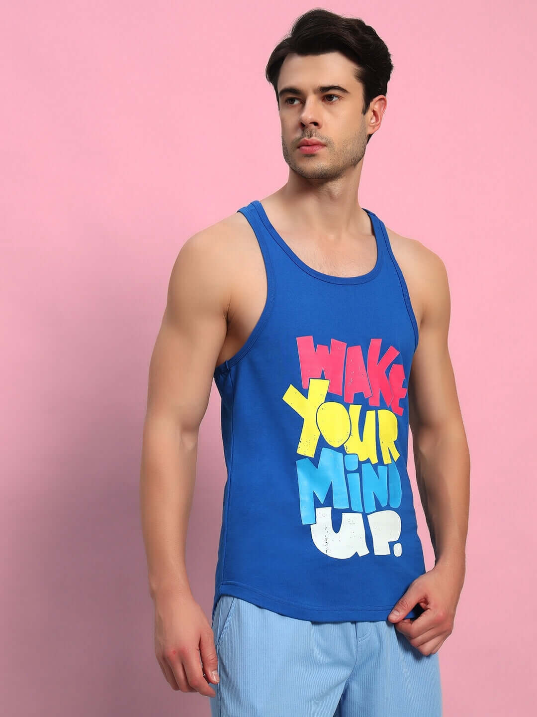 WAKE UP GYM T-SHIRT ROYAL BLUE shown on model, features vibrant text print suitable for workout or casual wear. Available in custom fit.