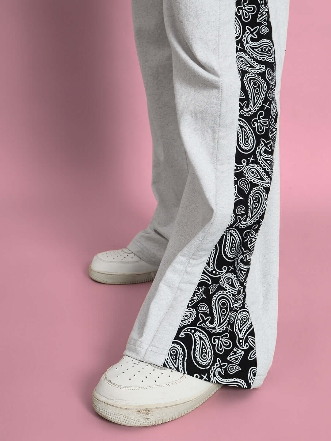 Close-up of WALTZ Relaxed Fit Joggers in Melange Grey with black paisley side stripe, perfect for customization and comfort.
