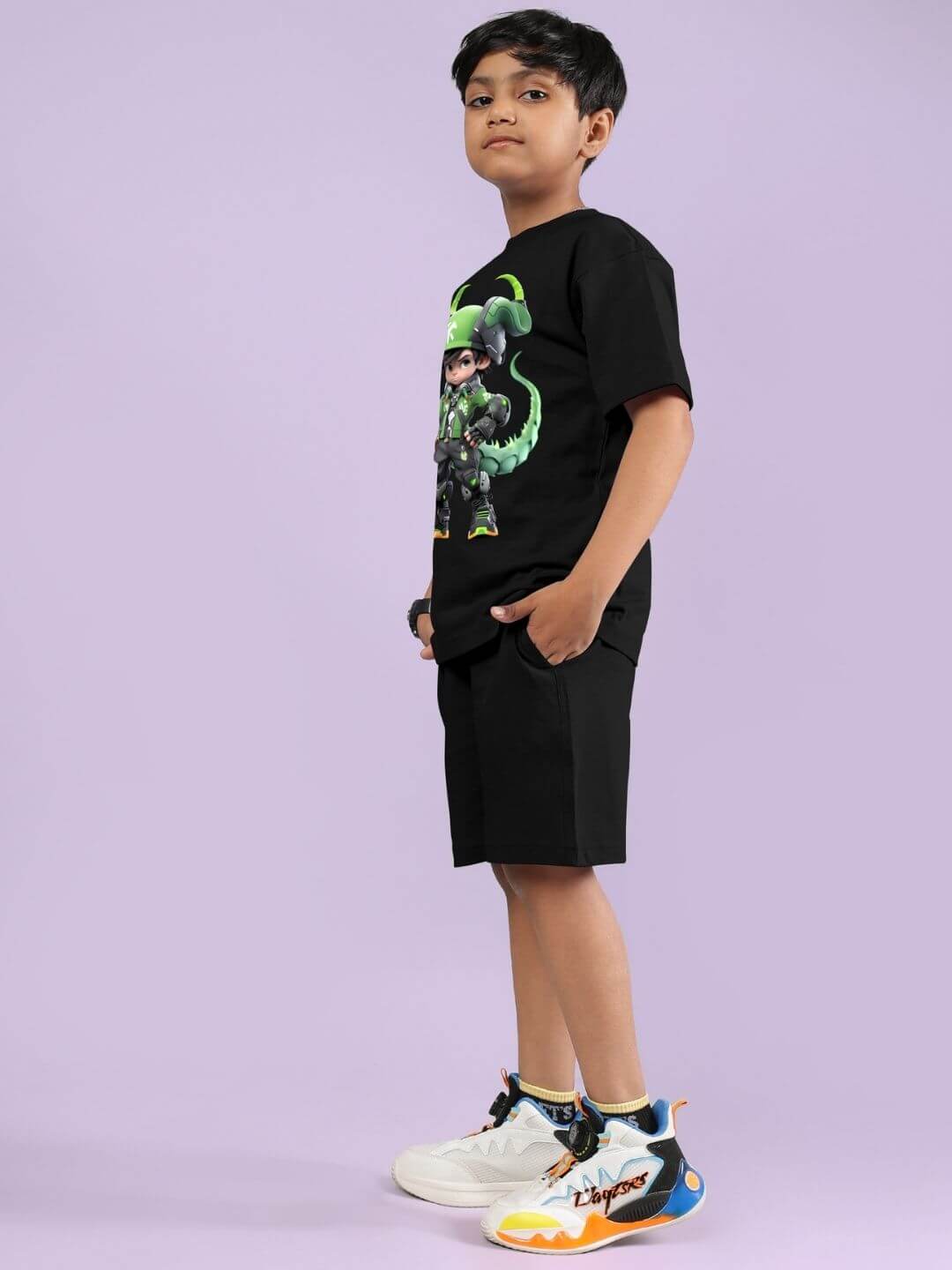 Child wearing black warrior with dragon co-ord set, featuring bold graphic on top and stylish shorts, on a light purple background.