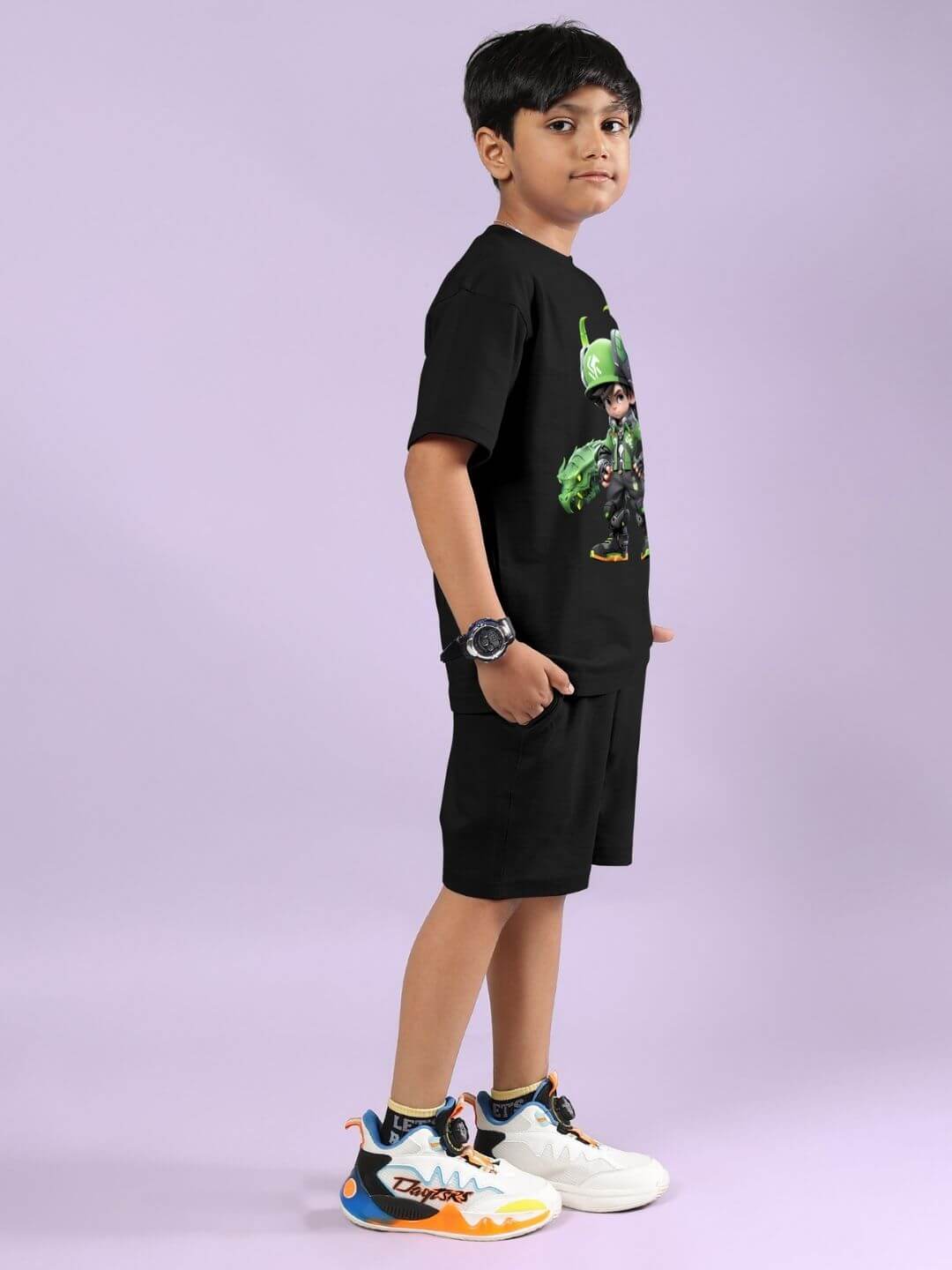 Child wearing Warrior with Dragon black co-ord set; features graphic tee and shorts, suitable for boys and girls.