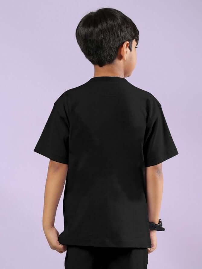Back view of child wearing Warrior With Dragon T-Shirt for Boys and Girls Black, showcasing comfortable and stylish design.