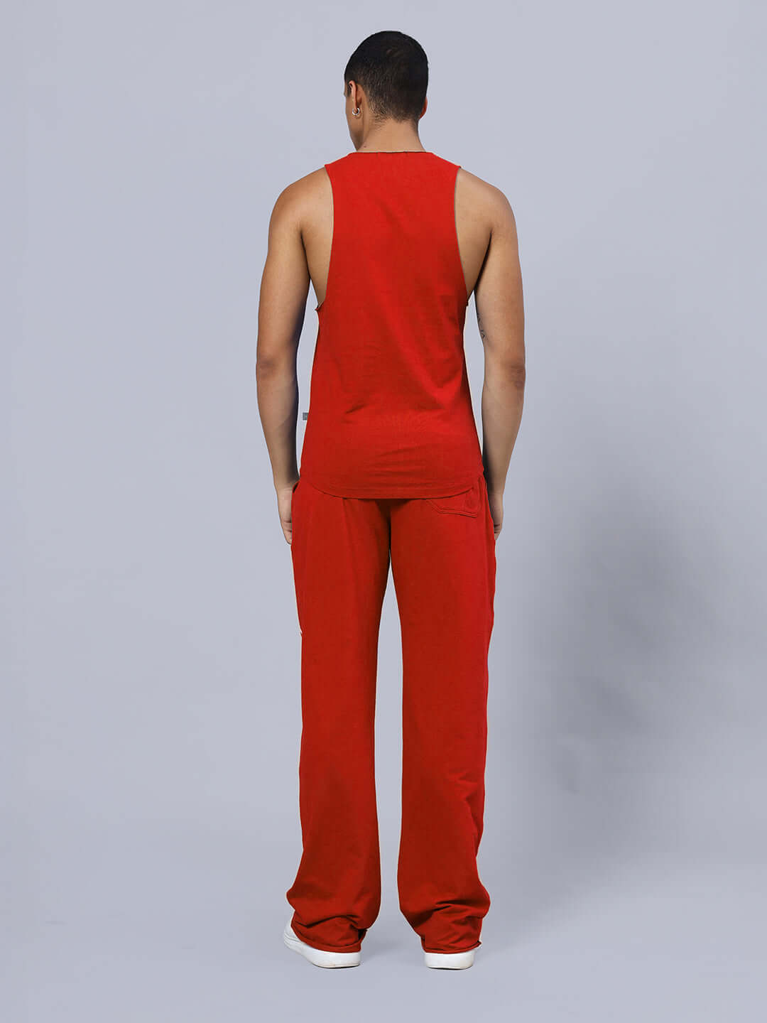 Model wearing WARRIOR PRINTED GYM RELAXED FIT CO-ORD SET RED from back view, showcasing relaxed fit and athletic style.
