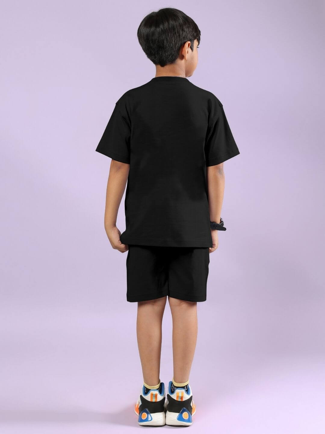 Child wearing WARRIOR WITH DRAGON CO-ORD FOR BOYS AND GIRLS BLACK set, showcasing back view of comfortable and stylish outfit